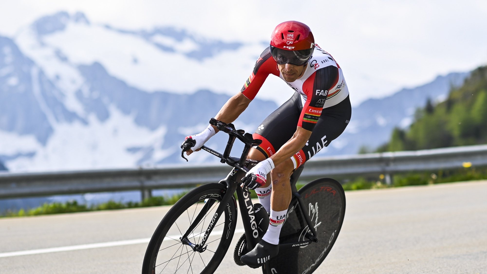 epa09265112 Rui Alberto Faria Da Costa from Portugal of Uae Team Emirates in action during the seventh stage, a 23.2 km time trial from Disentis-Sedrun to Andermatt, Switzerland at the 84th Tour de Suisse UCI ProTour cycling race, 12 June 2021.  EPA/GIAN EHRENZELLER