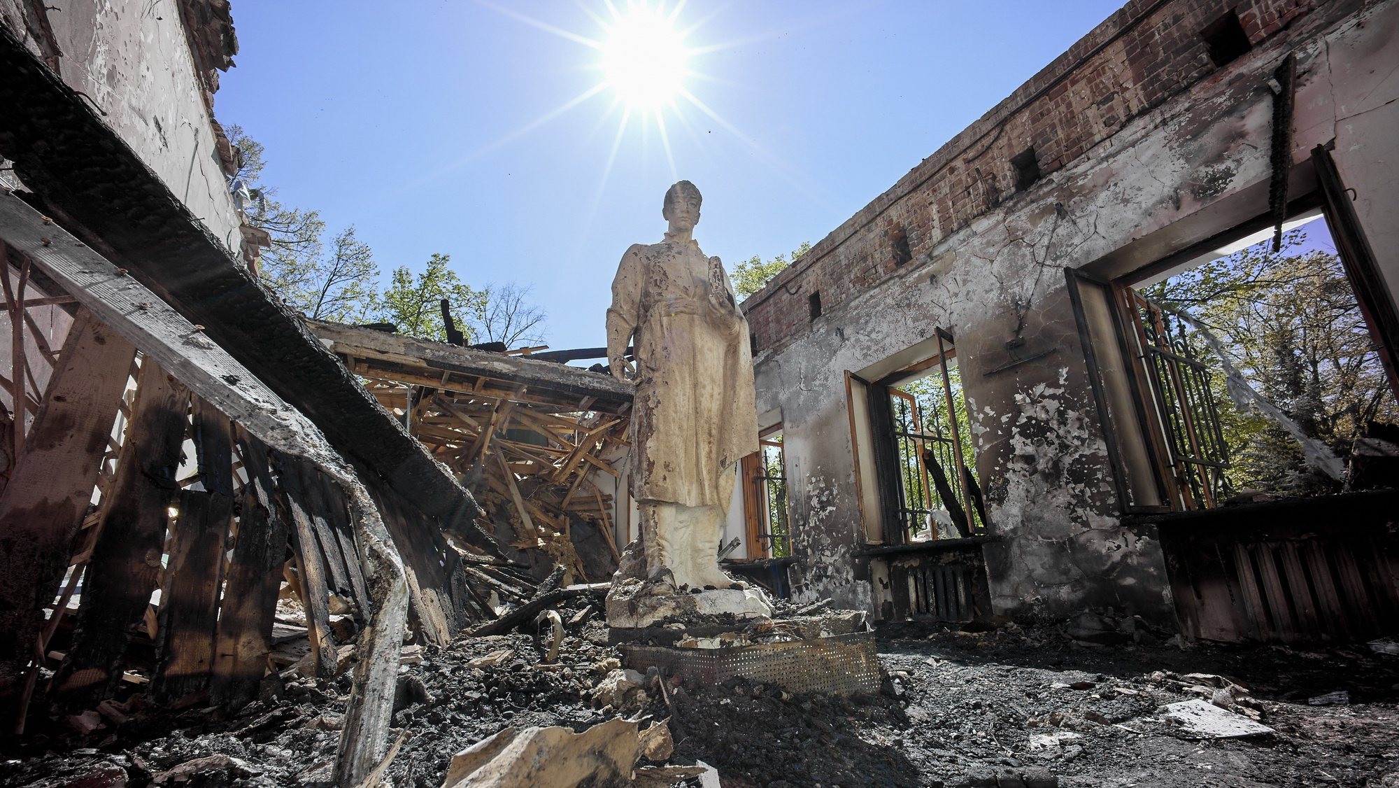epaselect epa09931872 A view of the statue of Ukrainian philosopher Hryhoriy Skovoroda standing in the damaged Hryhoriy Skovoroda Literary Memorial Museum after shelling in Skovorodynivka village near Kharkiv, Ukraine, 07 May 2022. Skovoroda, a famous philosopher and poet of the 18th century, spent the last years of his life in the estate of local landlords in the village of Ivanovka, which was later renamed in his honor, Skovorodynivka. Russian troops entered Ukraine on 24 February, resulting in fighting and destruction in the country and fears of shortages in energy and food products globally. According to data released by the United Nations High Commission for the Refugees (UNHCR) on 06 May, over 5.8 million refugees have fled Ukraine seeking safety, protection and assistance in neighboring countries, making this the fastest growing refugee crisis since World War II. Western countries have responded with various sets of sanctions against Russian state majority owned companies and interests in a bid to bring an end to the conflict.  EPA/SERGEY KOZLOV