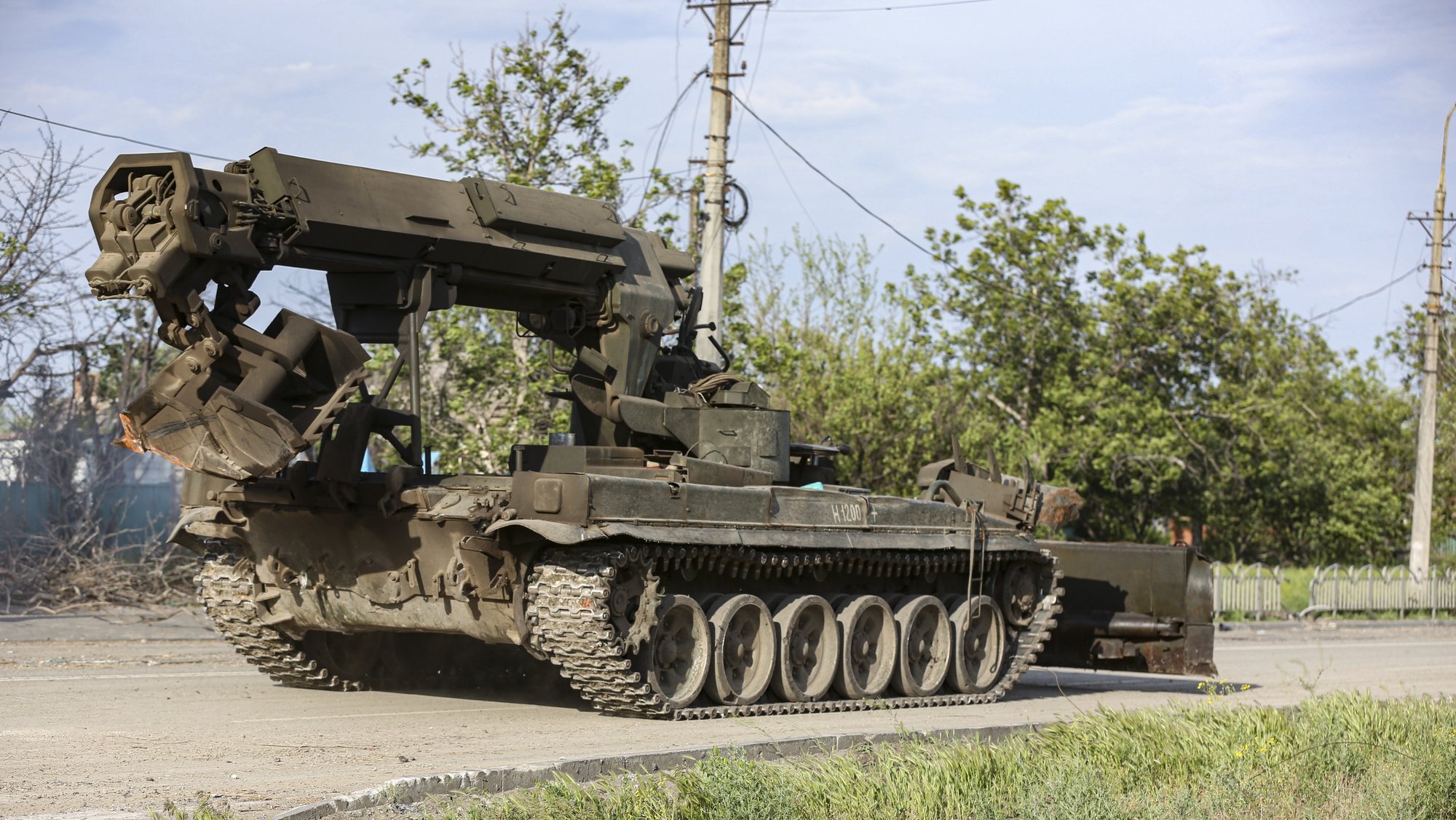 epa09965042 A Russian military vehicle moves towards the area surrounding the Azovstal steel plant to carry out a demining operation in Mariupol, Ukraine, 21 May 2022 (issued 22 May 2022). The Chief spokesman of the Russian Defense Ministry, Major General Igor Konashenkov, said on 20 May that the long-besieged Azovstal steel plant in Mariupol was under full Russian army control.  EPA/ALESSANDRO GUERRA