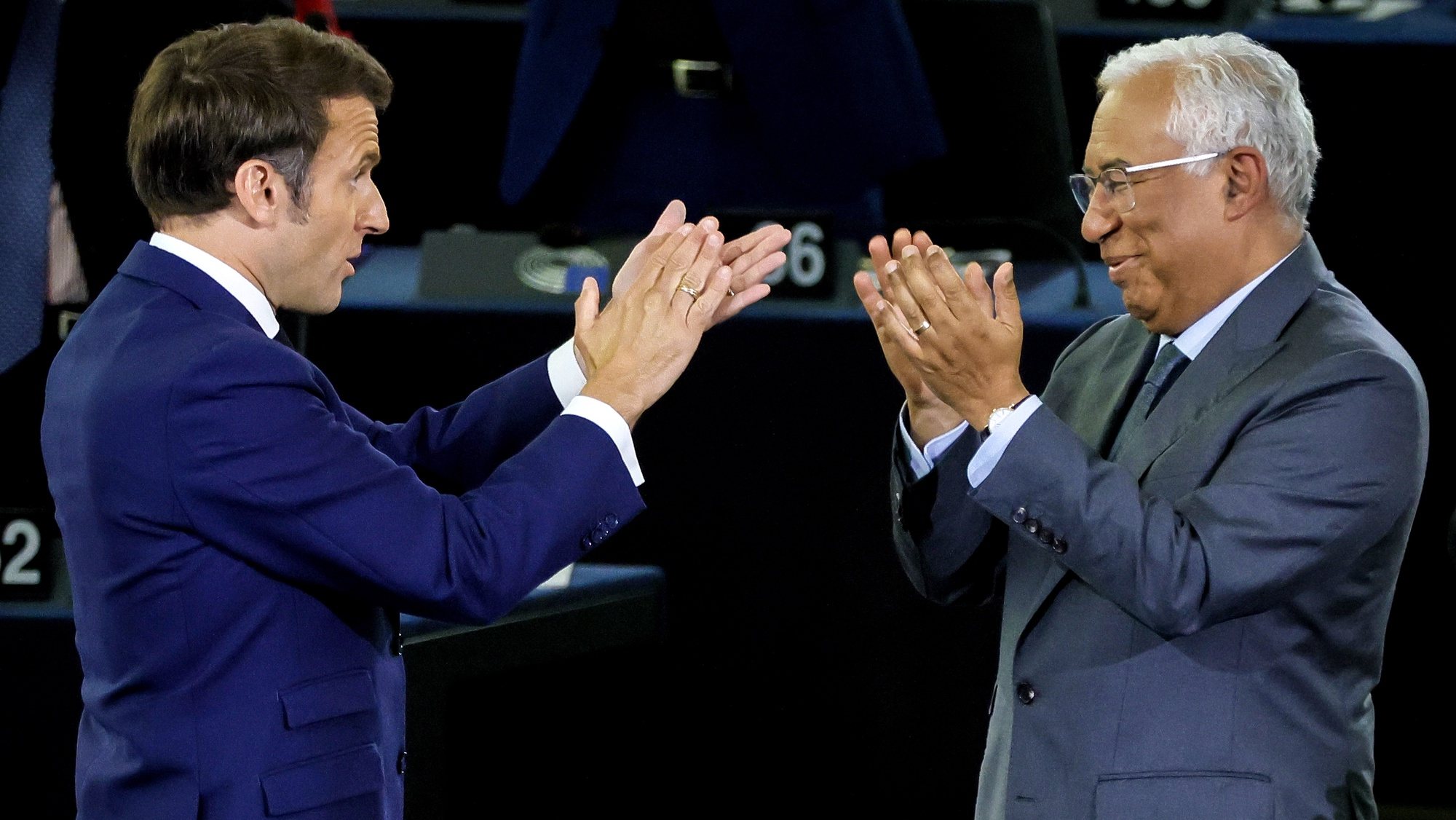 epa09935792 French President Emmanuel Macron (L) and Portugese Prime Minister Antonio Costa (R) applaud during the closing event of the Conference on the Future of Europe at the European Parliament in Strasbourg, France, 09 May 2022.  EPA/RONALD WITTEK