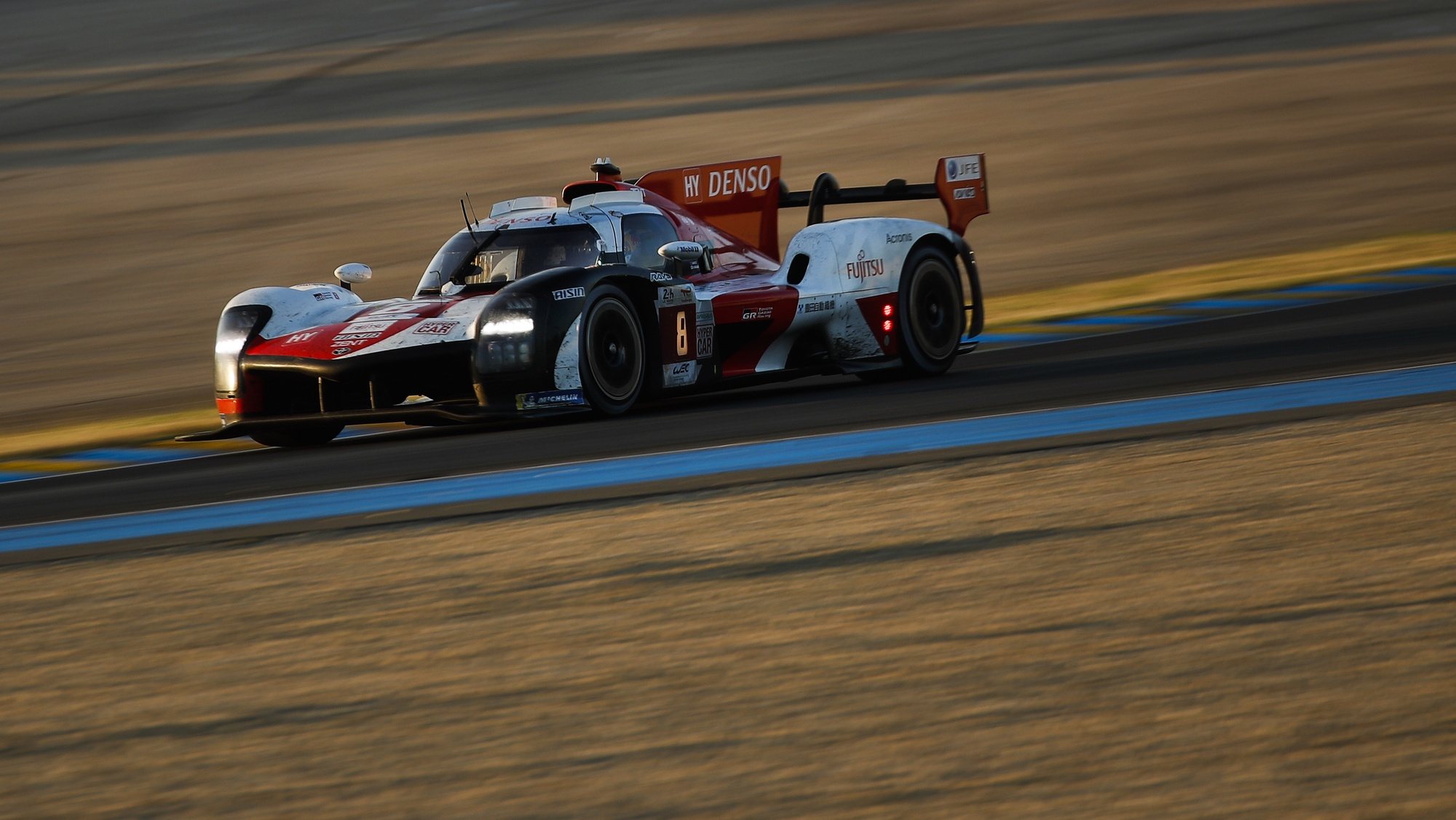 epa10009083 Toyota Gazoo Racing car (starting no.8) a Toyota GR010 Hybrid with Sebastien Buemi of Switzerland, Brendon Hartley of New Zealand and Ryo Hirakawa of Japan in action during Le Mans 24 Hours race in Le Mans, France, 12 June 2022.  EPA/YOAN VALAT