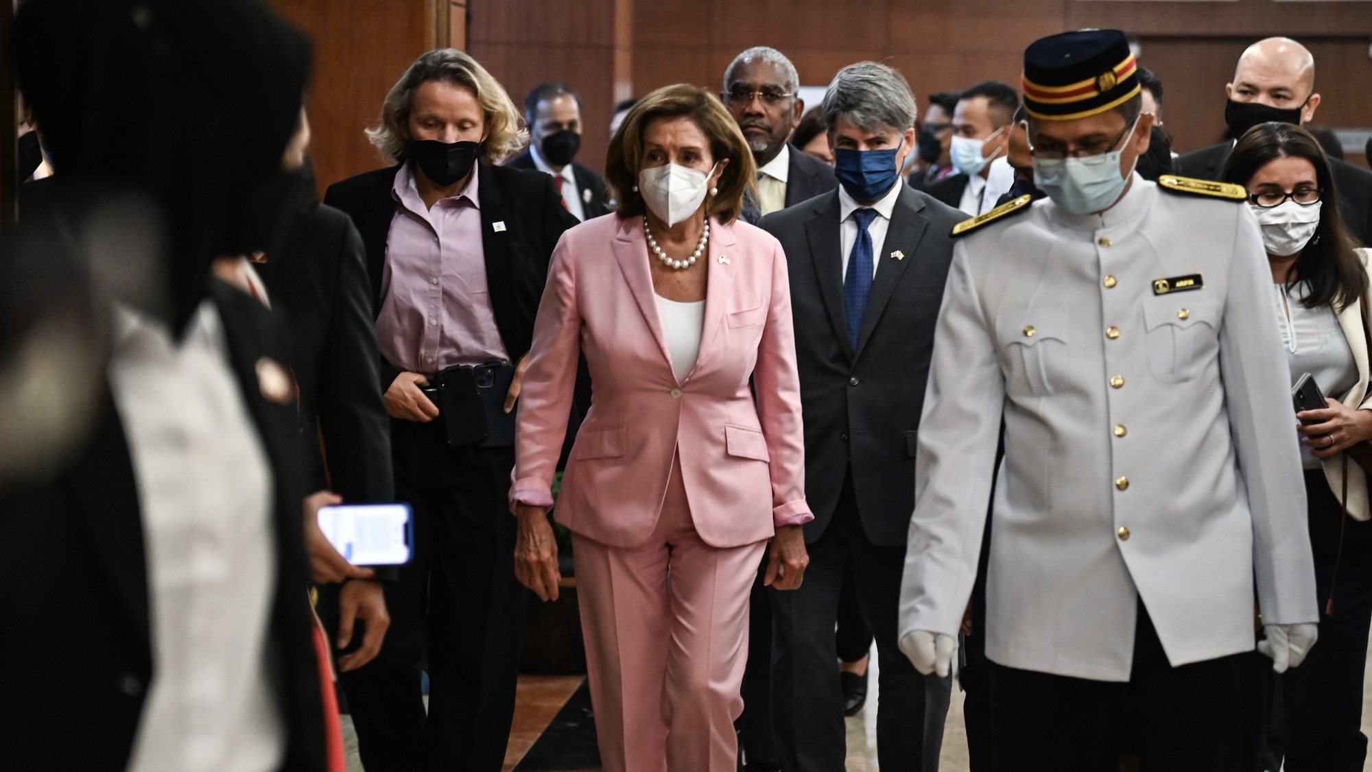 epa10102398 A handout photo made available by the Malaysia Information Ministry shows US Speaker of the House Nancy Pelosi (C) arriving at the Parliament building in Kuala Lumpur, Malaysia, 02 August 2022. Kuala Lumpur is Pelosi&#039;s second stop after Singapore before she heads to South Korea and Japan and probably Taiwan. Several Taiwan media outlets reported Nancy Pelosi was set to visit Taiwan on 02 August.  EPA/Nazri Rapaai / HANDOUT  HANDOUT EDITORIAL USE ONLY/NO SALES