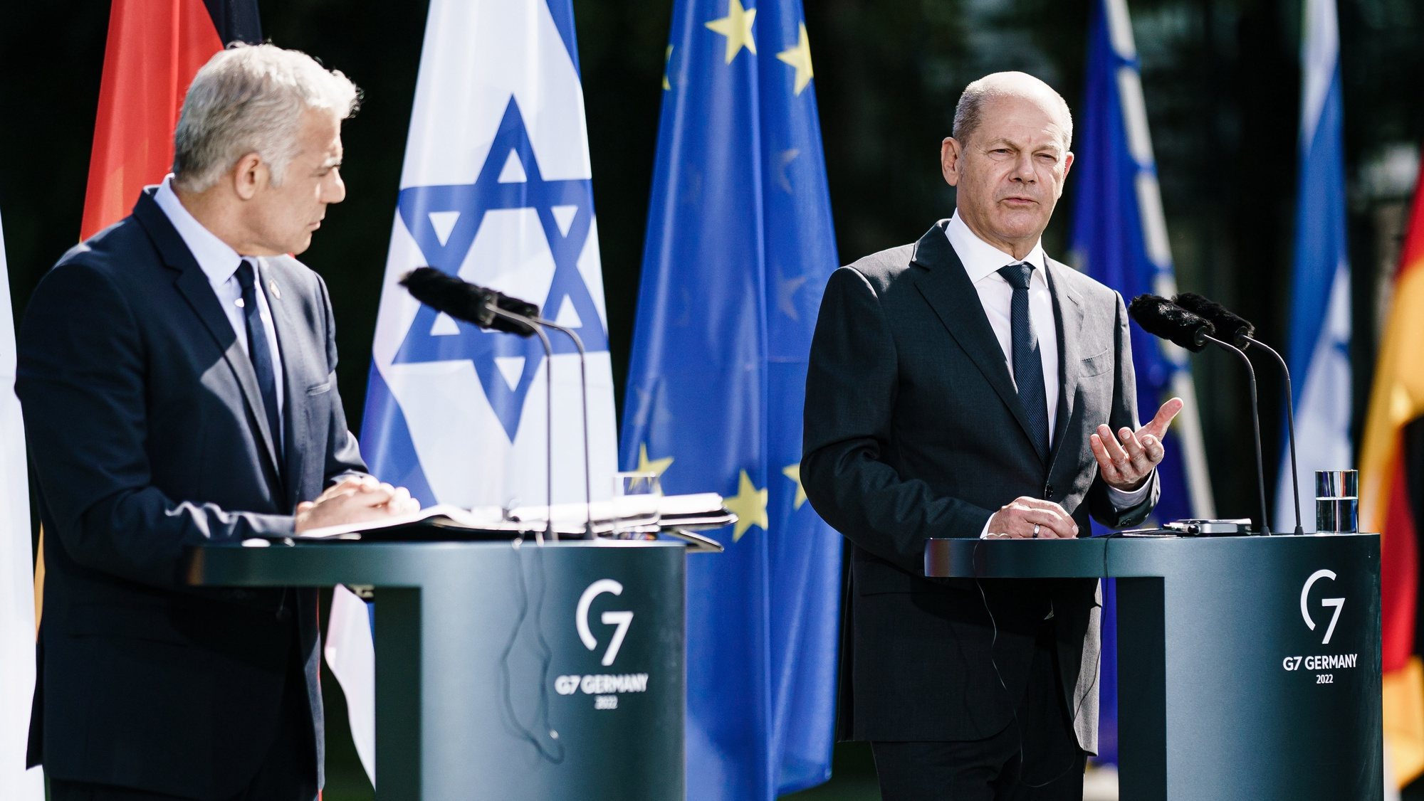 epa10179674 German Chancellor Olaf Scholz (R) gestures as he speaks next to Israeli Prime Minister Yair Lapid (L) during a joint press conference at the chancellery in Berlin, Germany, 12 September 2022. German Chancellor Olaf Scholz and Israeli Prime Minister Yair Lapid met for bilateral talks.  EPA/CLEMENS BILAN