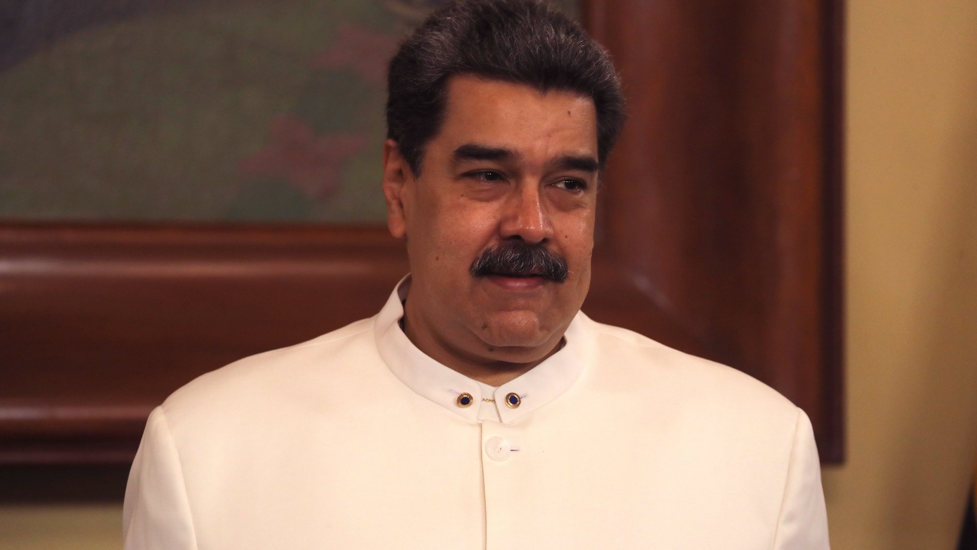 epa10146234 President of Venezuela, Nicolas Maduro smiles prior to an act with the new Colombian ambassador to the country, Armando Benedetti, at the Miraflores Palace in Caracas, Venezuela, 29 August 2022. Benedetti, presented his credentials to Maduro in the midst of the reestablishment of diplomatic relations after they were severed three years ago.  EPA/Miguel Gutierrez