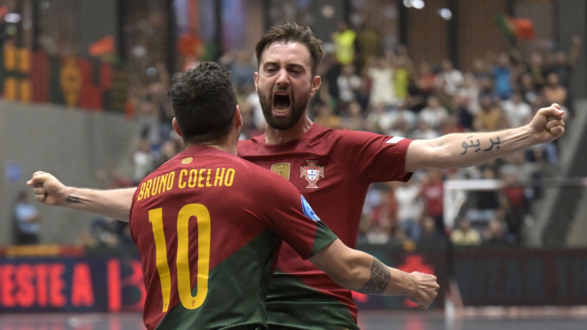 Portugal player Tiago Brito (R) and Bruno Coelho celebrate a goal against Belarus during the World Cup 2024 Qualifying Round 4 futsal match, held at Paredes Multipurpose Pavilion, in Paredes, Portugal, 6 October 2022. FERNANDO VELUDO/LUSA