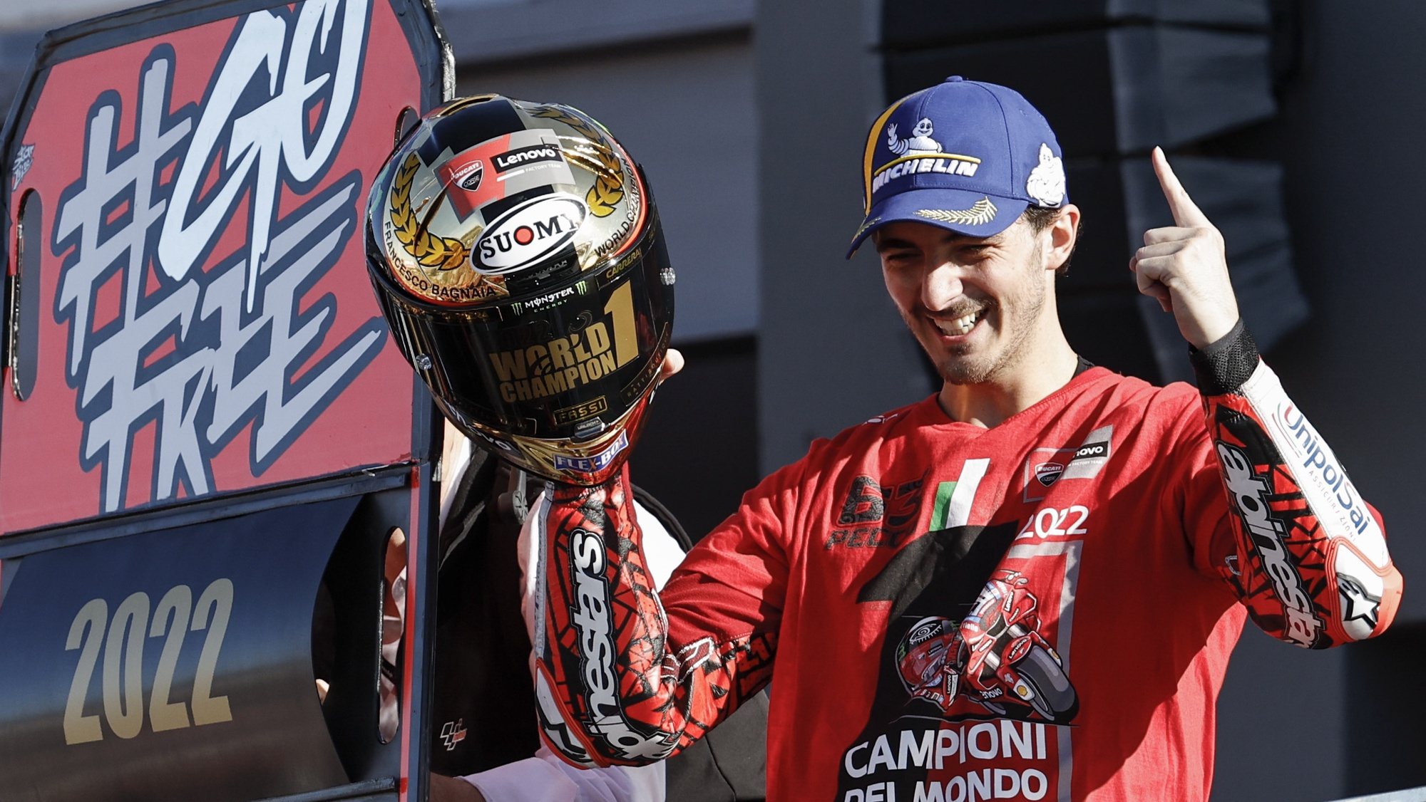 epa10290310 Moto GP rider Francesco Bagnaia celebrates on the podium after becoming world champion of his category at the race held at Ricardo Tormo Circuit in Cheste, Valencia, 06 November 2022, during Comunidad Valenciana Motorciclyng Grand Prix, the last Grand Prix of the season.  EPA/Biel Alino