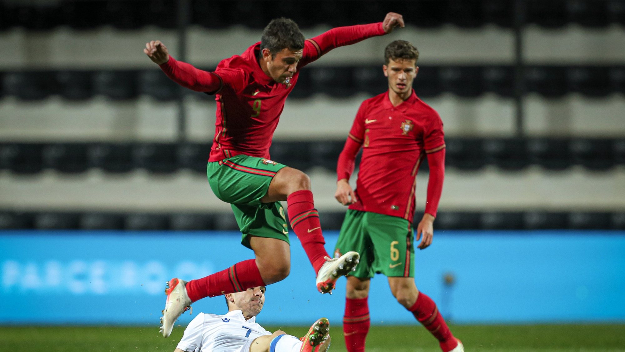 Portuguese national team player, Henrique Araujo (C), disputes the ball with the Cyprus national team player, Costi (L), in the qualifying match for the 2023 Under-21 European Soccer Championship (Euro2023), Faro, Portugal, November 16, 2021. LUÍS FORRA/LUSA