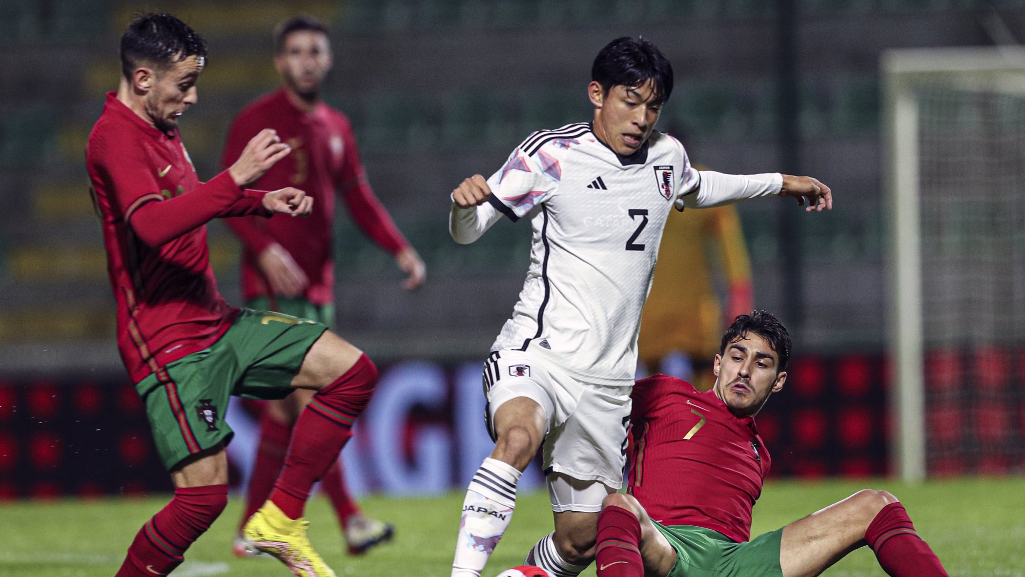 Portugal Under-21 soccer player, Andre Almeida (R), in action against Japan`s Riku Handa during their friendly match in preparation for the final phase of Georgia/Romania 2023 Under-21 European Soccer Championship, held at Portimonense Sytadium, Portimao, Portugal, 22 November 2022. LUIS FORRA/LUSA