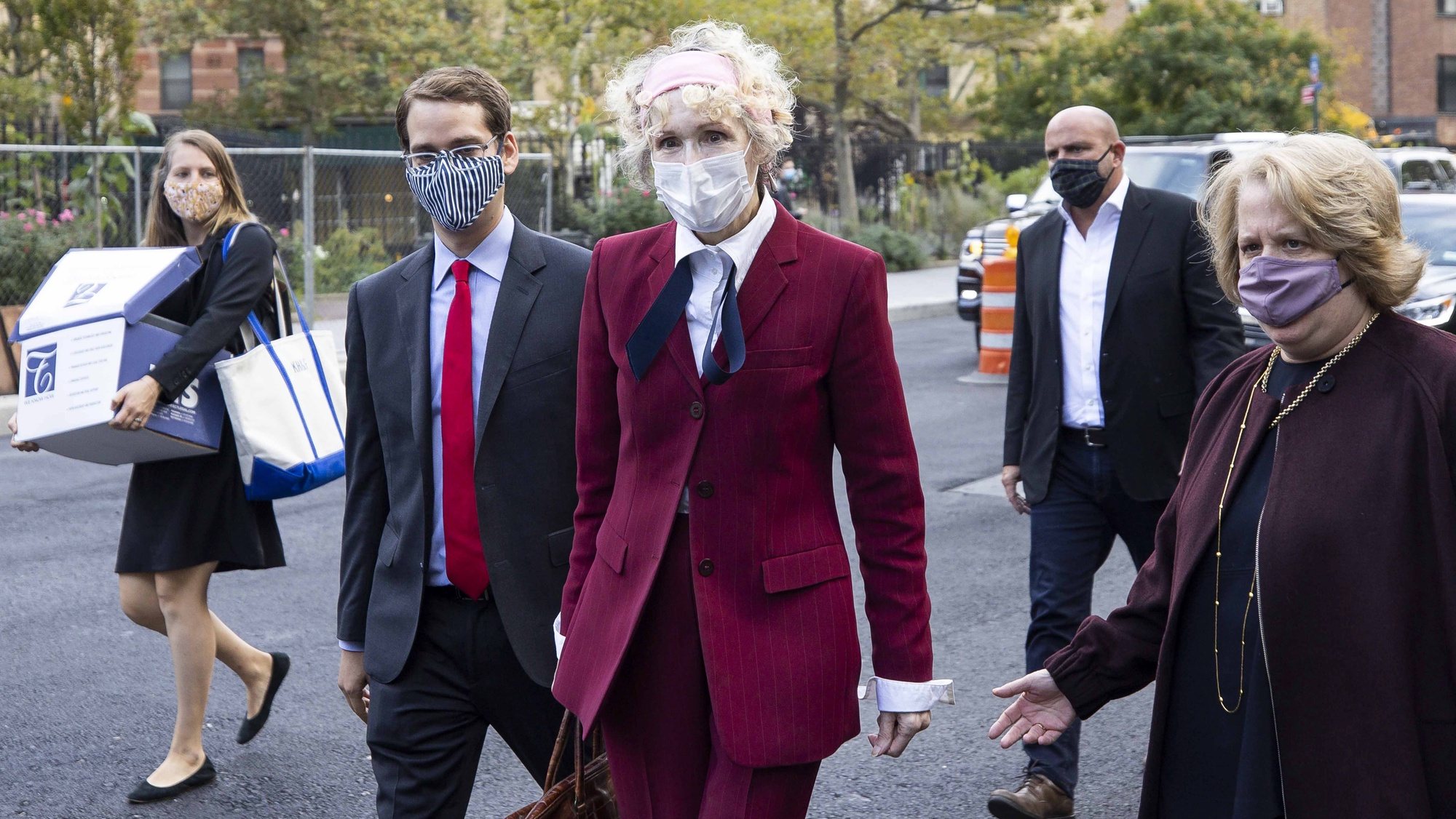 epa08762948 E. Jean Carroll (C) arrives to Federal District Court to attend a hearing where her attorneys and attorneys for the US Justice Department are arguing about a motion to have the US substituted as the defendant in Carroll&#039;s defamation suit against US President Donald J. Trump in New York, New York, USA, 21 October 2020. Carroll, who has accused Trump of raping her in a dressing room in the 1990s, has sued Trump for a number of allegedly defamatory statements he made after the release of her book in 2019.  EPA/JUSTIN LANE