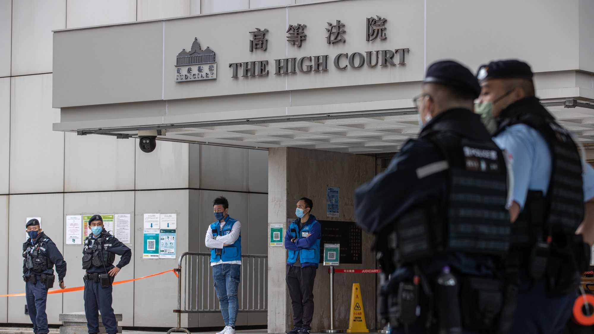 epa10340514 Police stand guard outside the High Court on the first day of the trial under national security law of media tycoon Jimmy Lai Chee-ying in Hong Kong, China, 01 December 2022. Lai is being tried under the national security law for conspiracy to print, publish, sell, offer for sale, distribute, display and/or reproduce seditious publications. Hong Kong Chief Executive John Lee Ka-chiu has asked the National Peopleâ€™s Congress (NPC) Standing Committee, Beijingâ€™s top legislative body, to interpret the cityâ€™s national security law after the Court of Final Appeal upheld a decision allowing a British barrister to defend Lai. The trial has been adjourned to 13 December 2022.  EPA/JEROME FAVRE
