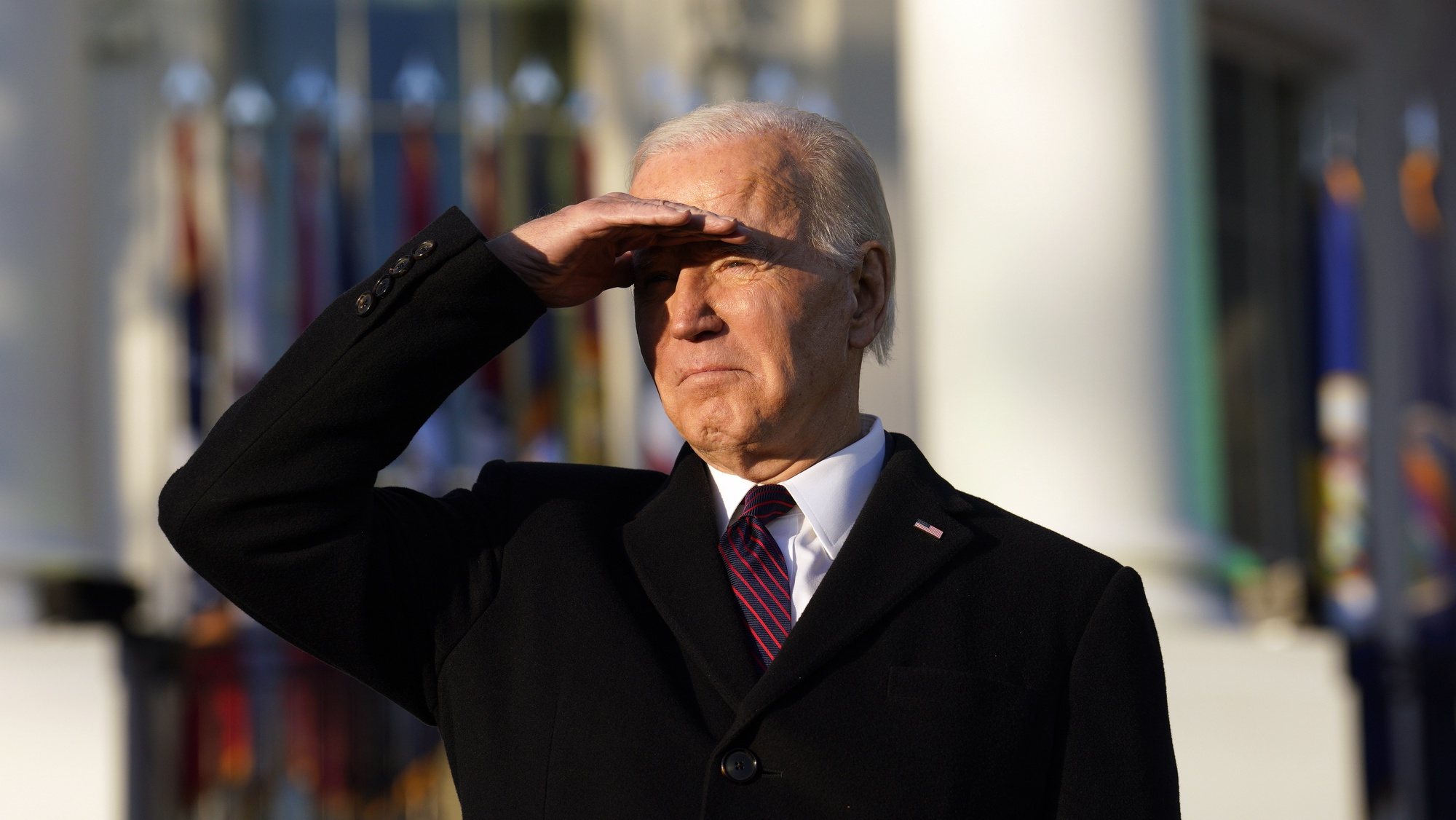 epa10364583 US President Joe Biden shields his eyes during the Respect for Marriage Act cememony on the South Lawn of the White House in Washington, DC, USA, 13 December 2022. The Respect for Marriage Act protects same-sex marriage and interracial marriage.  EPA/YURI GRIPAS / POOL