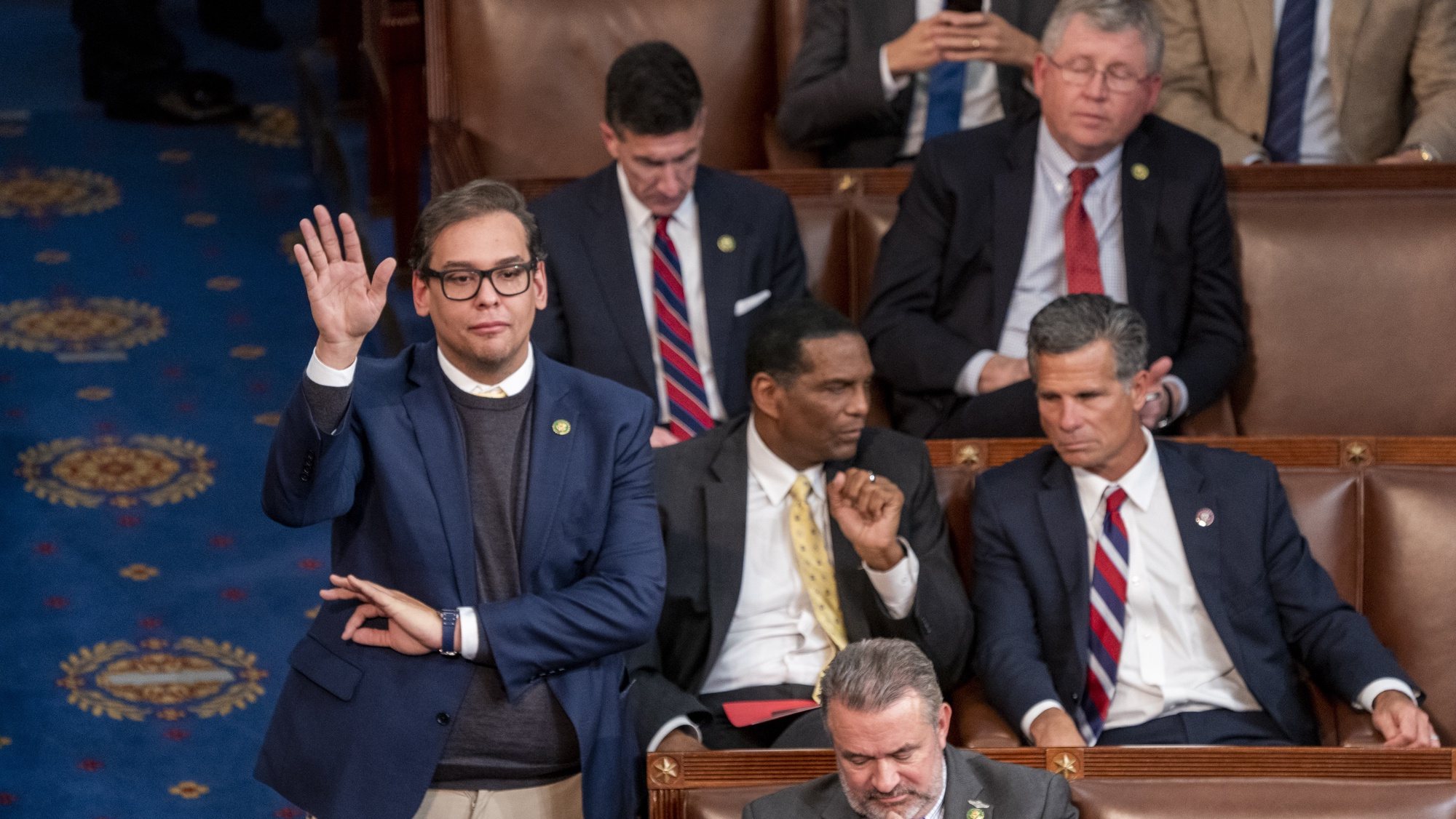 epa10391240 Republican Representative elect from New York George Santos gestures as he votes in the House chamber on the third day of the House of Representatives trying to determine who will become the next Speaker of the House, on Capitol Hill in Washington, DC, USA 05 January 2023. After numerous rounds of voting McCarthy has failed to secure enough votes to become House Speaker and faces serious opposition from his own Republican caucus, putting his bid for Speaker of the House in jeopardy.  EPA/SHAWN THEW