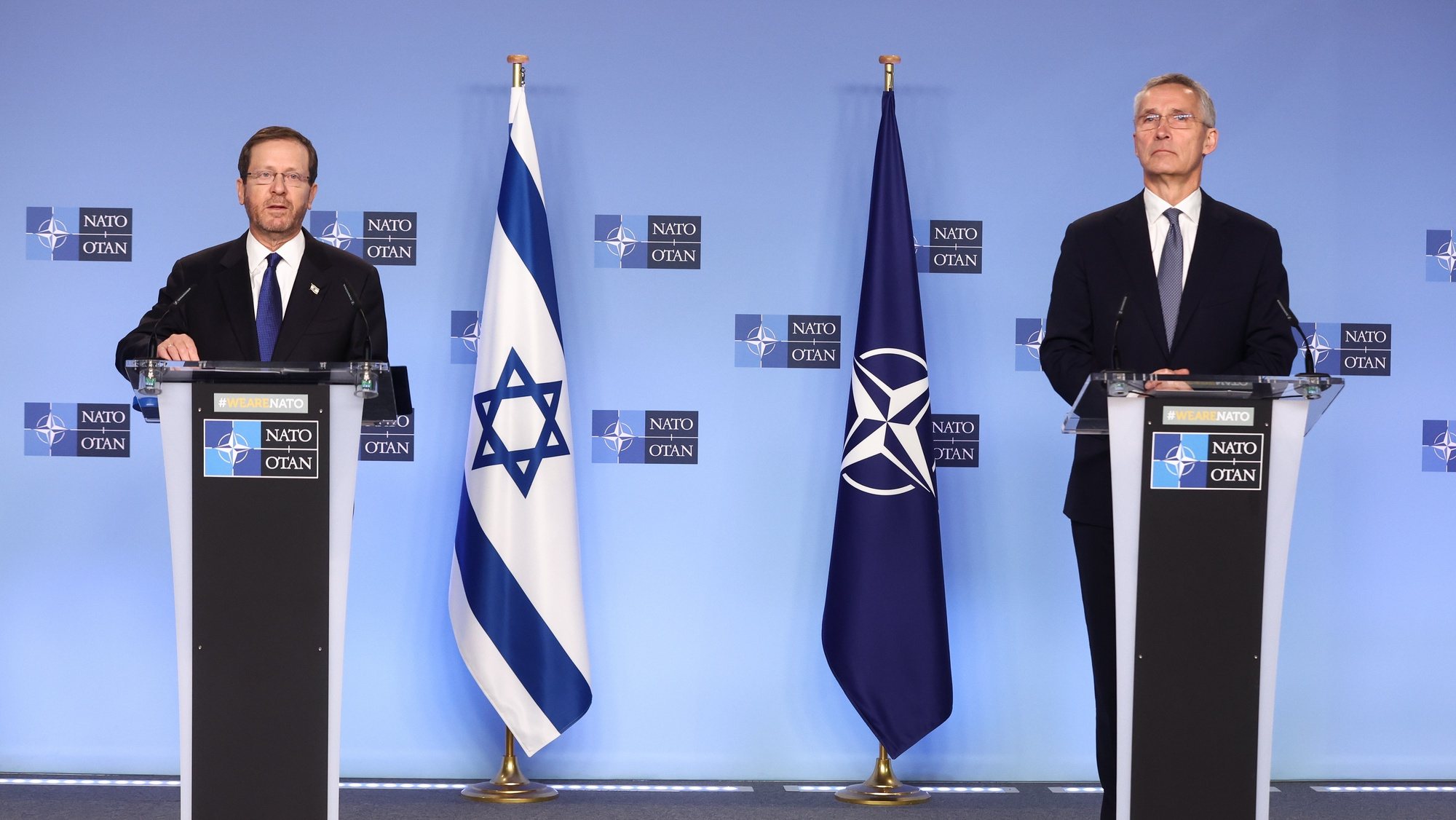 epa10431431 Israel President Isaac Herzog (L) and NATO Secretary General Jens Stoltenberg give statements to the press ahead of a meeting of the North Atlantic Council at NATO headquarters in Brussels, Belgium, 26 January 2023. According to the Israeli Government Press Office, Herzog began on 25 January a two-day official visit in Belgium, where he met with leaders of the European Unionâ€™s institutions, the Belgian government and NATO Secretary-General Jens Stoltenberg and representatives of NATO member-states.  EPA/STEPHANIE LECOCQ