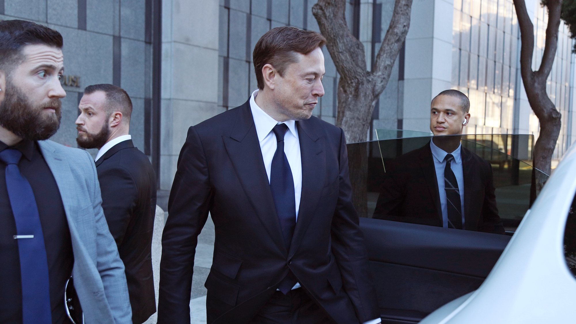 epa10427389 Tesla CEO Elon Musk leaves the Phillip Burton Federal Building and U.S. Courthouse for the fourth day of the trial of Tesla shareholders lawsuit against Musk in San Francisco, California, USA, 24 January 2023. Tesla shareholders against CEO Elon Musk are taking him to court after he tweeted in 2018 that he could take Tesla private at 240 US dollars a share, a statement that caused volatility in the electric car company&#039;s stock price.  EPA/GEORGE NIKITIN