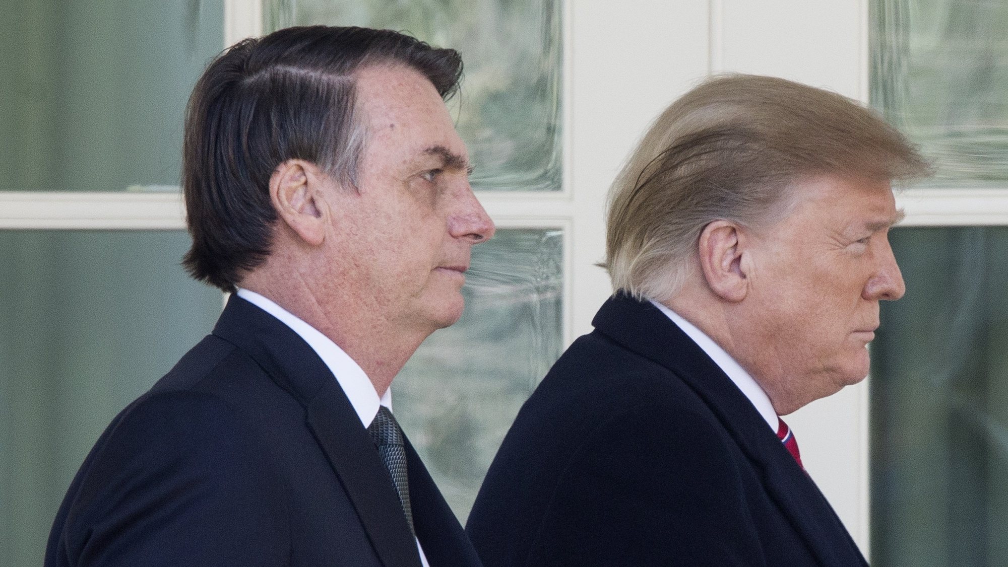 epa08939614 (FILE) US President Donald J. Trump (R) and Brazilian President Jair Bolsonaro (L) walk down the Colonnade to hold a joint news conference in the Rose Garden of the White House in Washington, DC, USA, 19 March 2019. Bolsonaro, a right-wing nationalist who earned the nickname the &#039;Trump of the Tropics,&#039; met with President Trump for bilateral negotiations and a joint press conference. The presidency of Donald Trump, which records two impeachments, will end at noon on 20 January 2021.  EPA/MICHAEL REYNOLDS *** Local Caption *** 55069012