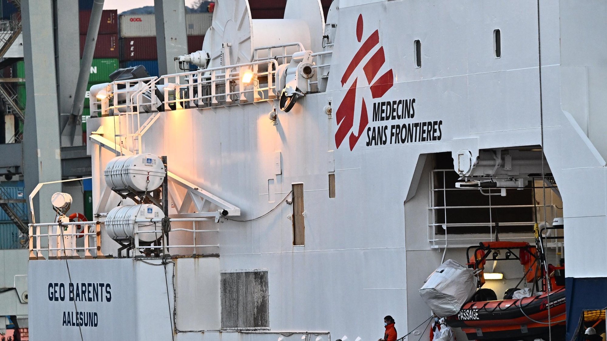 epa10436594 Health officers assist migrants to leave the Geo Barents ship of the MSF docked at the port of La Spezia, Italy, 28 January 2023. Doctors Without Frontiers (MSF) said on 25 January that the Geo Barents conducted its third rescue of the last few days and has 237 asylum seekers on board, adding that 107 people, including 36 minors and five women, were picked up from an overloaded dinghy in the latest operation.  EPA/LUCA ZENNARO