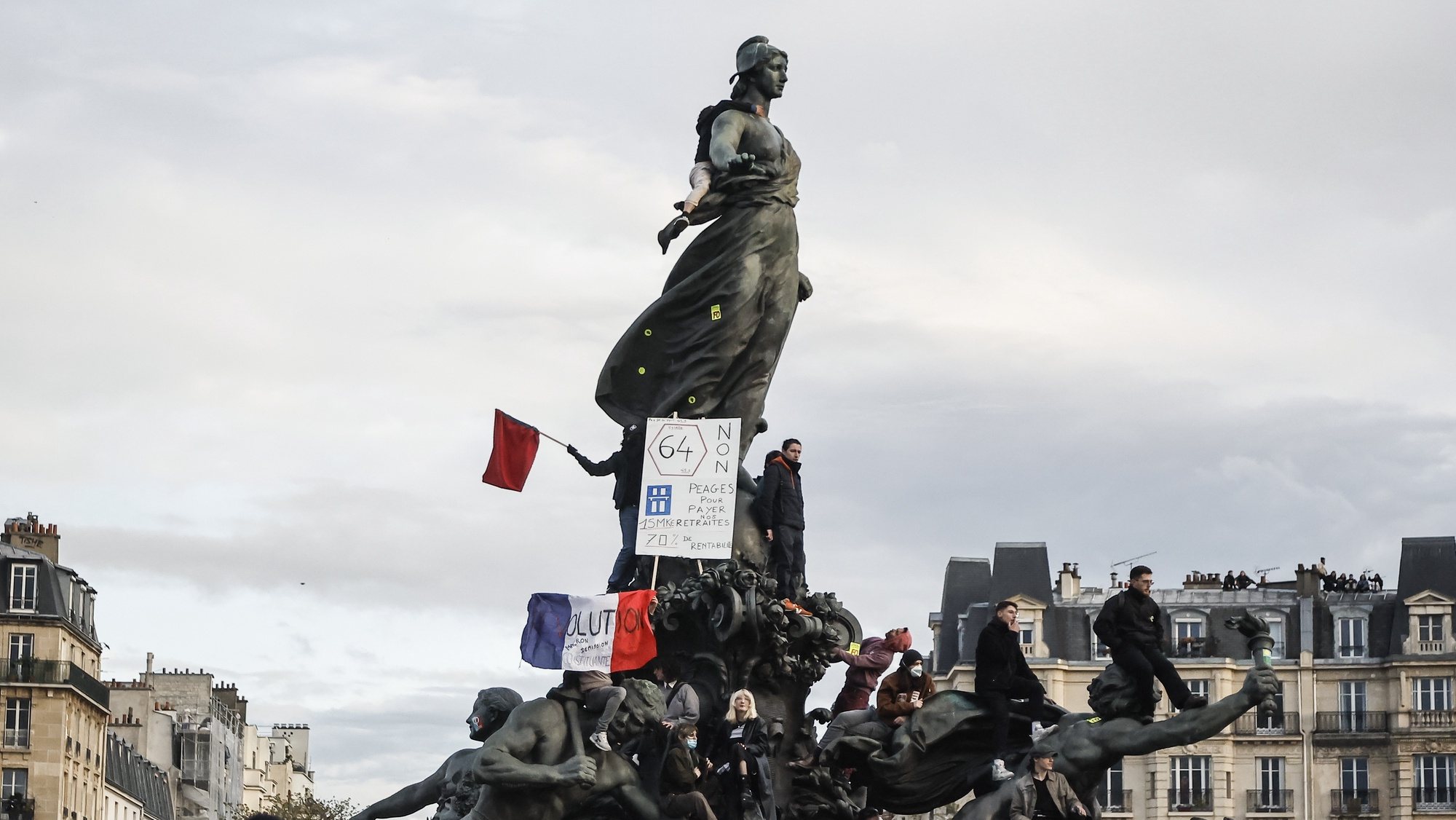 epa10547650 Protesters climb on &#039;The Triumph of the Republic&#039; statue depicting the Marianne during a rally against the government&#039;s pension reform in Paris, France, 28 March 2023. France faces an ongoing national strike against the government&#039;s pensions reform after tthe French prime minister announced on 16 March 2023 the use of Article 49 paragraph 3 (49.3) of the French Constitution to have the text on the controversial pension reform law - raising retirement age from 62 to 64 - be definitively adopted without a vote.  EPA/CHRISTOPHE PETIT TESSON