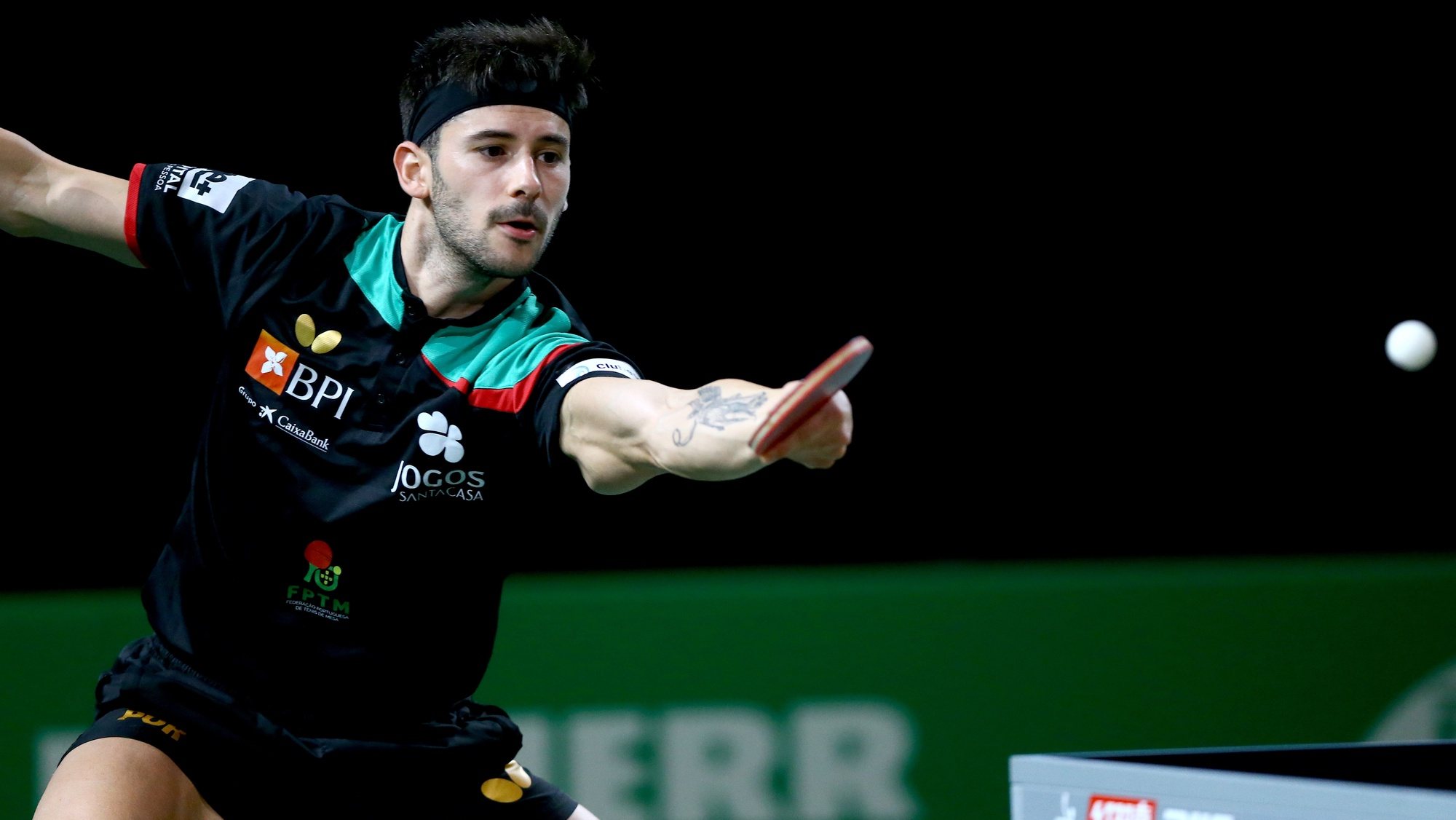 epa10652261 Joao Geraldo of Portugal in action in the Men&#039;s Sinlges Round of 16 match against Wang Chuqin of China at the 2023 ITTF World Table Tennis Championships in Durban, South Africa, 25 May 2023.  EPA/KIM LUDBROOK