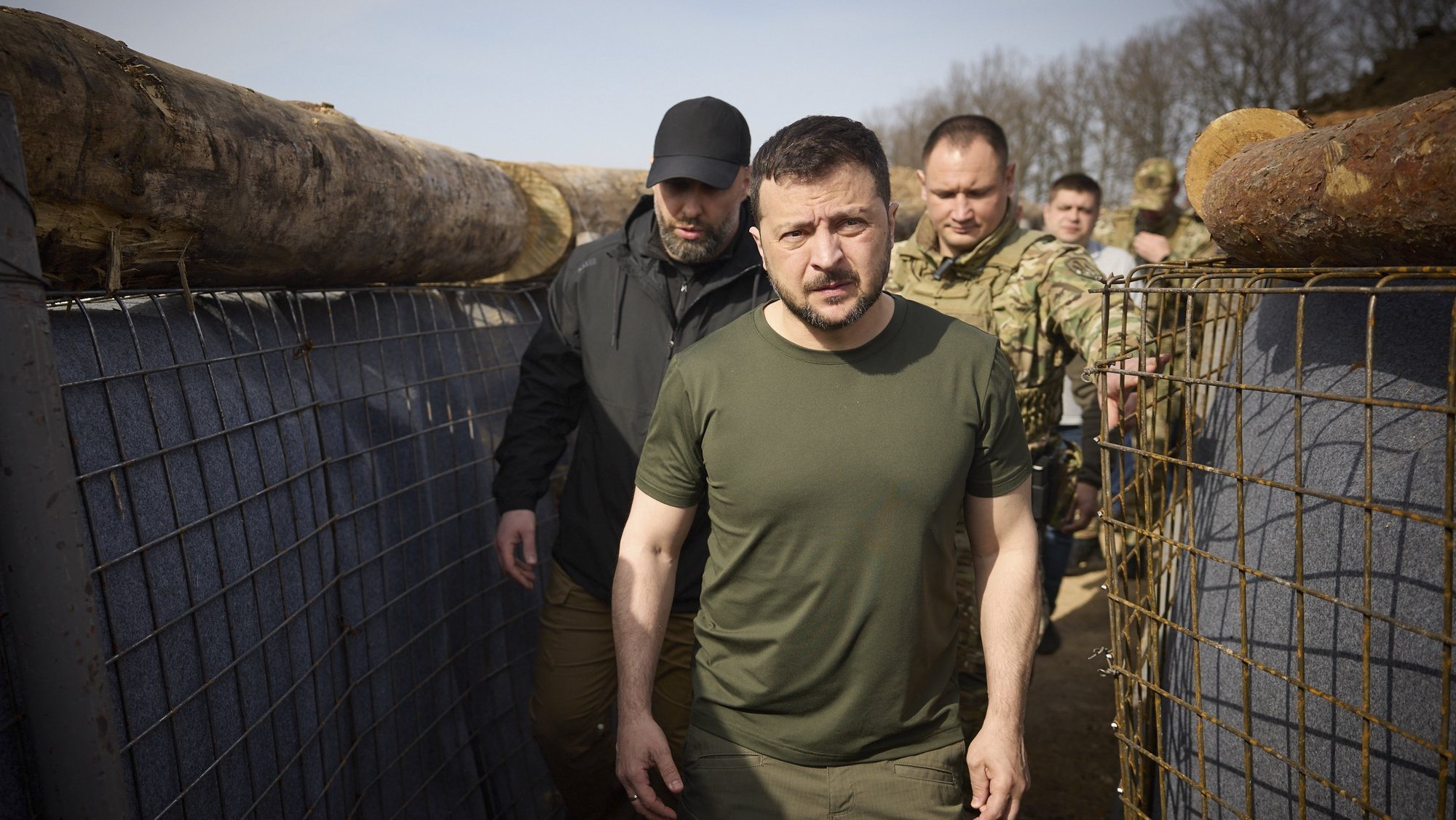 epa11267436 A handout photo made available by the Presidential Press Service shows Ukrainian President Volodymyr Zelensky (C) and the head of the Kharkiv Regional Military Administration Oleh Syniehubov (L background) visit the construction site of a defence line in the Kharkiv region, Ukraine, 09 April 2024 amid the Russian invasion. Russian troops entered Ukrainian territory on 24 February 2022, starting a conflict that has provoked destruction and a humanitarian crisis.  EPA/PRESIDENTIAL PRESS SERVICE HANDOUT HANDOUT  HANDOUT EDITORIAL USE ONLY/NO SALES HANDOUT EDITORIAL USE ONLY/NO SALES