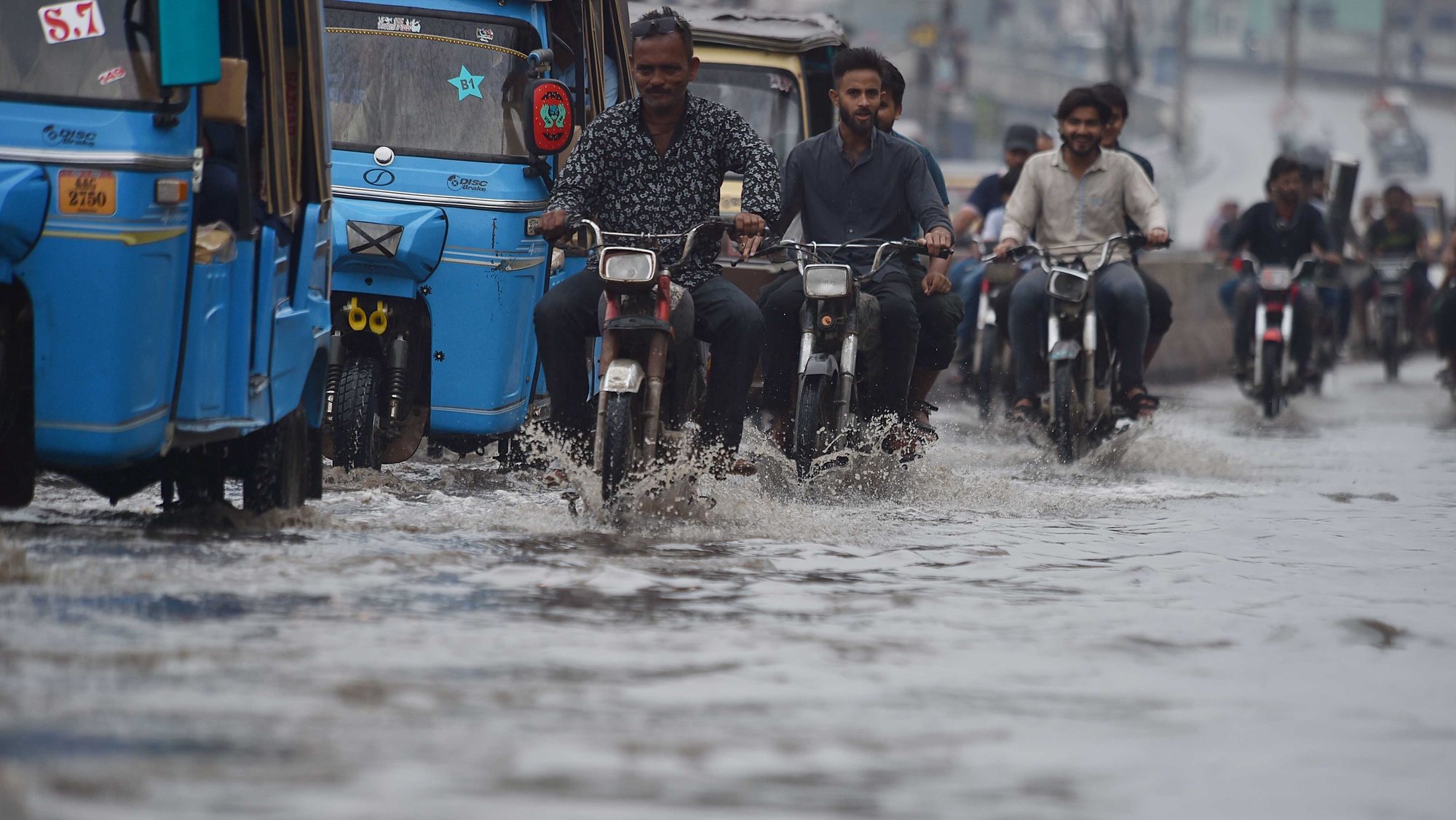 epa11278190 People ride motorcycles during heavy rain in Karachi, Pakistan, 14 April 2024. At least 29 people have died and another seven have been injured in the last two days due to lightning strikes and incidents related to the heavy rains affecting several provinces of Pakistan, rescue officials said. In total, 17 people died in the northeastern province of Punjab, in addition to eight deaths in southern Balochistan and four in northern Khyber Pakhtunkhwa.  EPA/SHAHZAIB AKBER