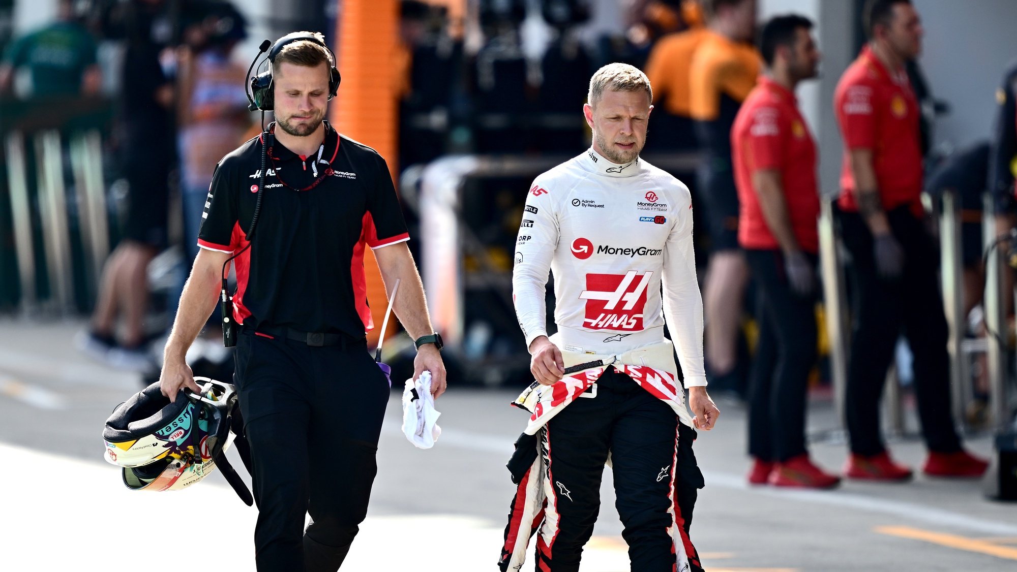 epa11444919 Haas driver Kevin Magnussen of Denmark walks in front of the garages during the Qualifying for the Formula One Austrian Grand Prix, in Spielberg, Austria, 29 June 2024. The 2024 Formula 1 Austrian Grand Prix will be held at the Red Bull Ring racetrack on 30 June.  EPA/CHRISTIAN BRUNA / POOL