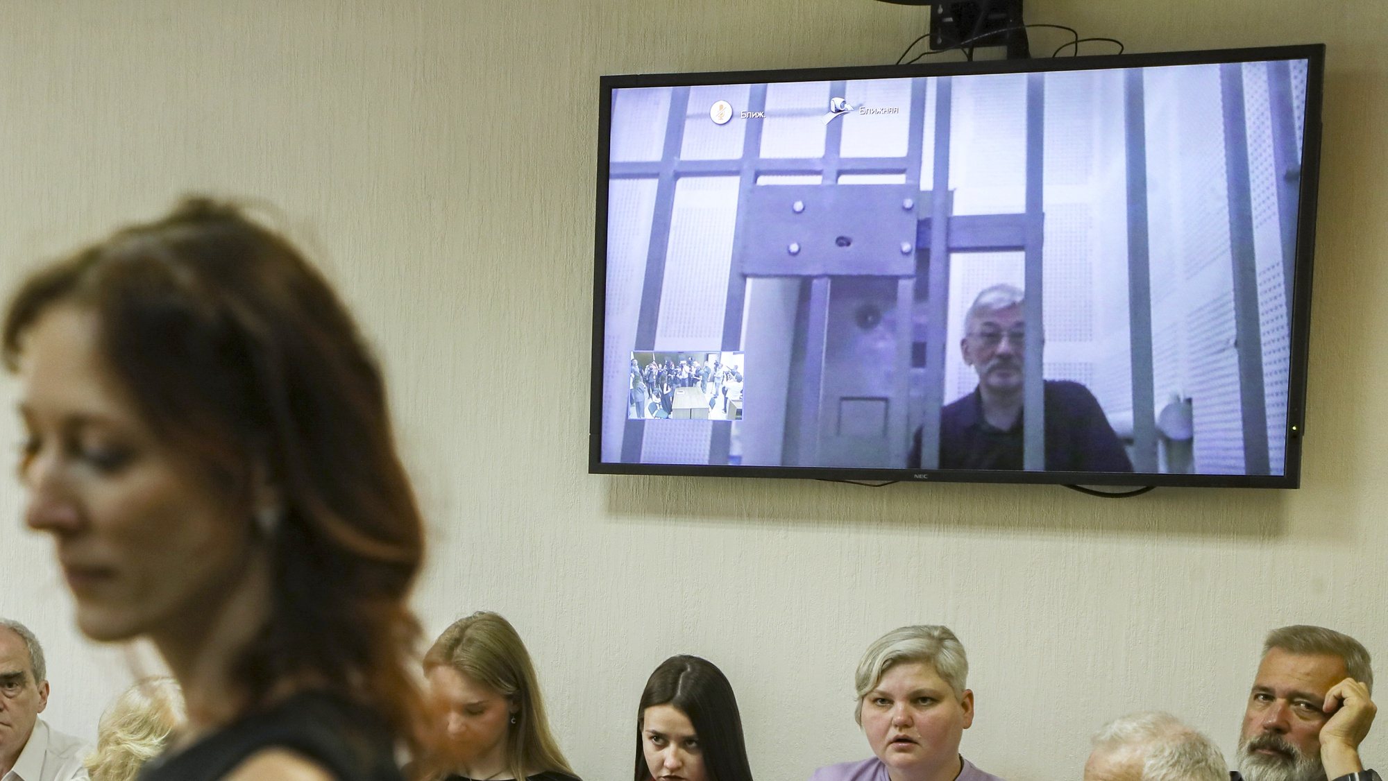 epa11472041 Nobel Peace Prize laureate and editor-in-chief of the independent newspaper Novaya Gazeta, Dmitry Muratov (R) sits near a television screen showing jailed human rights activist Oleg Orlov as he participates in a court appeal hearing via video link from his prison against his sentence at the Moscow City Court in Moscow, Russia, 11 July 2024. The Golovinsky Court of Moscow sentenced Oleg Orlov, co-chair of the Memorial human rights center (liquidated by a Supreme Court ruling), to two and a half years in prison on February 27, 2024, for &#039;repeatedly discrediting the Russian army. &#039;  EPA/MAXIM SHIPENKOV