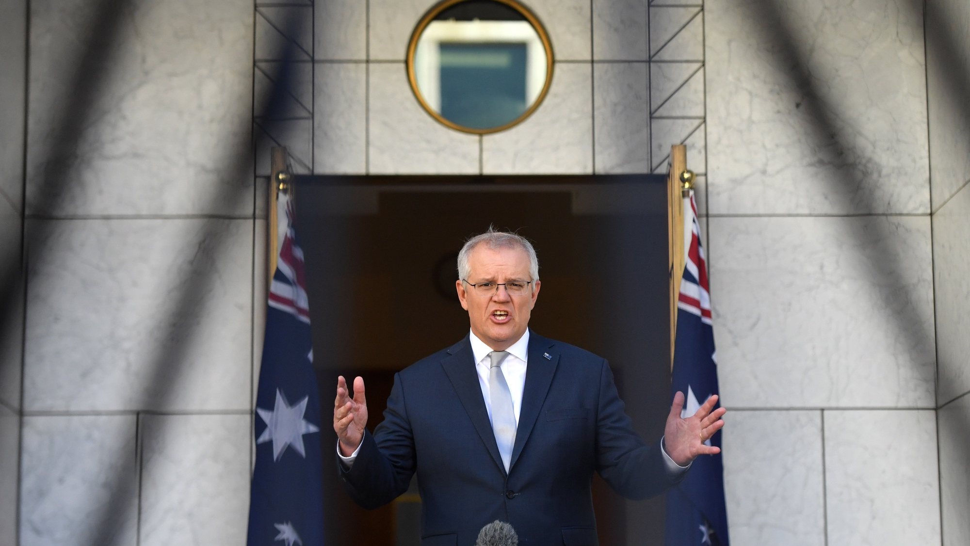 epaselect epa09535399 Australian Prime Minister Scott Morrison speaks during a morning television interview in his courtyard at Parliament House in Canberra, Australian Capital Territory, Australia, 21 October 2021.  EPA/MICK TSIKAS AUSTRALIA AND NEW ZEALAND OUT