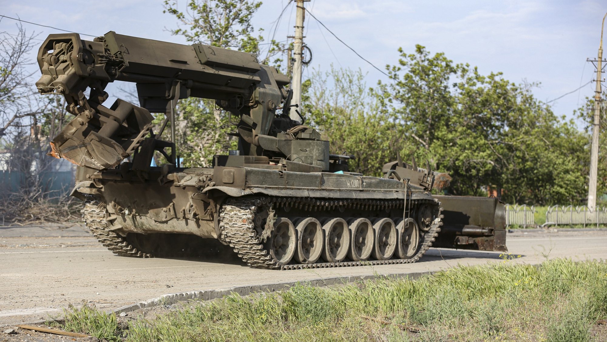 epa09965042 A Russian military vehicle moves towards the area surrounding the Azovstal steel plant to carry out a demining operation in Mariupol, Ukraine, 21 May 2022 (issued 22 May 2022). The Chief spokesman of the Russian Defense Ministry, Major General Igor Konashenkov, said on 20 May that the long-besieged Azovstal steel plant in Mariupol was under full Russian army control.  EPA/ALESSANDRO GUERRA