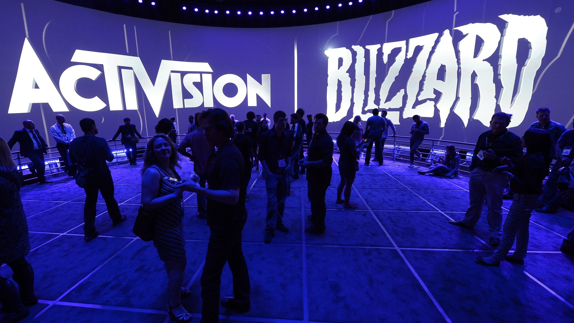 epa09693177 (FILE) - Attendees gather at the Activision Blizzard exhibit at the E3 (Electronic Entertainment Expo) in Los Angeles, California, USA, 12 June 2013 (reissued 18 January 2022). Microsoft on 18 January 2022 in a press release confirmed it will ill acquire video games giant Activision Blizzard &quot;in an all-cash transaction valued at 68.7 billion US dollars.&quot; The deal forms the biggest takeover by Microsoft to date.  EPA/MICHAEL NELSON *** Local Caption *** 55533336