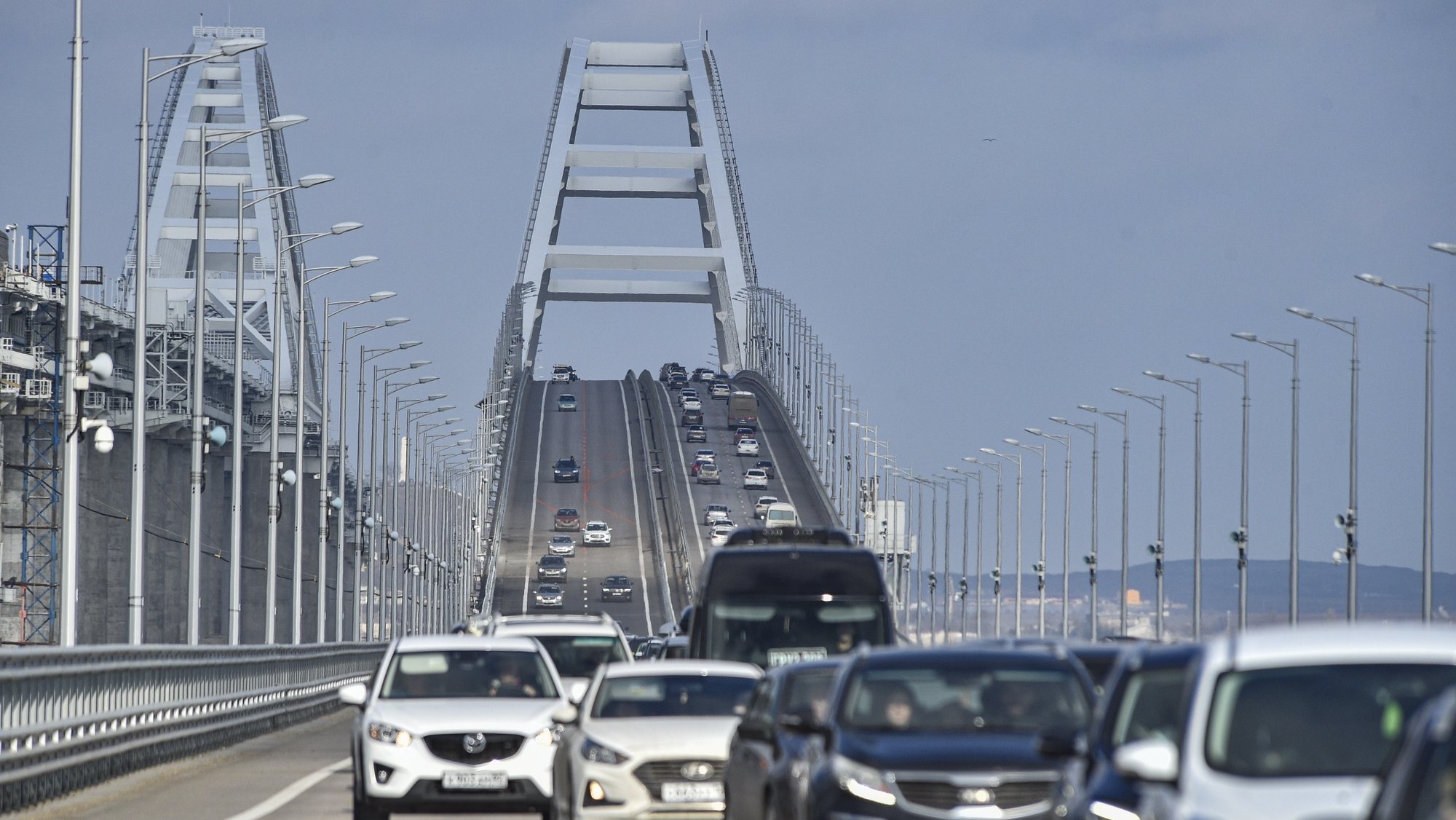 epa10485423 Cars drive across the Crimean bridge in Crimea, 23 February 2023. Automobile traffic resumed on all lanes of the Crimean bridge on 23 February, 39 days ahead of schedule, the press service of Russia&#039;s Deputy Prime Minister Marat Khusnullin announced. The motorway of the Crimean Bridge was damaged by an explosion last October. To restore the bridge, some 2,442 tons of metal structures were manufactured, which were delivered from Tyumen, Voronezh and Kurgan. The builders needed to replace four spans on both sides of the bridge, lay two layers of asphalt concrete pavement and install lighting masts.  EPA/STRINGER