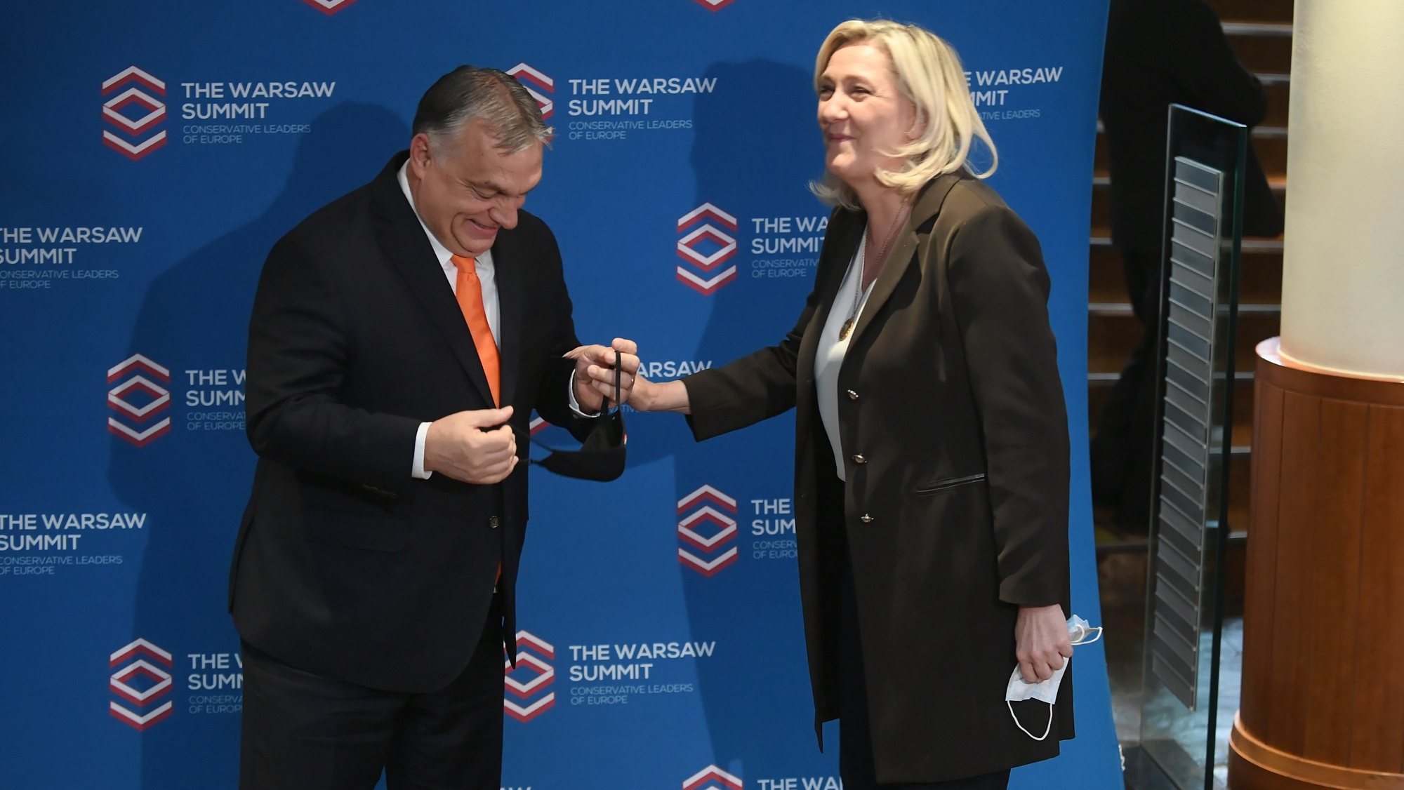 epa09620359 French far-right Rassemblement National party (RN) leader Marine Le Pen (R) and Hungarian Prime Minister Viktor Orban (L) before the Leaders European conservative and right-wing parties meeting &#039;The Warsaw Summit&#039; at the Regent Hotel in Warsaw, Poland, 04 December 2021. The leaders of the European conservative and right-wing parties met in Warsaw.  EPA/MARCIN OBARA POLAND OUT