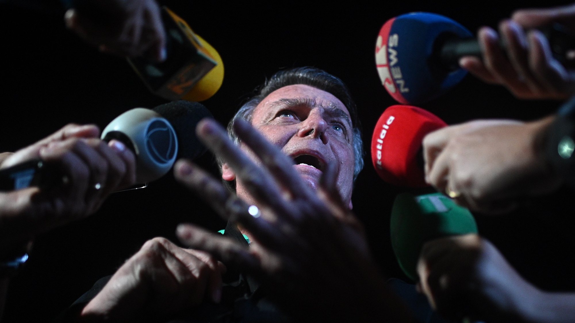 epa10720103 Former President of Brazil Jair Bolsonaro (2019-2022), speaks to the press as he leaves the airport in Brasilia, Brazil, 30 June 2023. Bolsonaro was stripped of his political rights by the electoral Court which found him guilty of abuses of power during the 2022 campaign that brought progressive Luiz Inacio Lula da Silva to the presidency.  EPA/Andre Borges