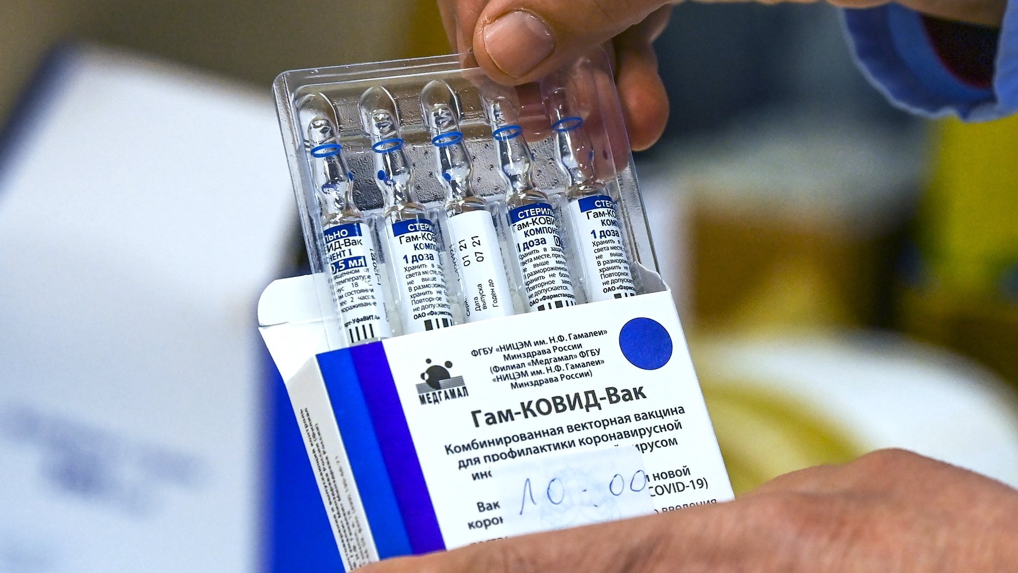 epa09088749 (FILE) A nurse takes out from the box vials of the Russian Sputnik V vaccine against coronavirus - disease (COVID-19) during vaccination at Jane Sandanski Polyclinic in Skopje, Republic of North Macedonia, 10 March 2021 (reissued 21 March 2021). Commissioner Breton on 21 March on French TV TF1 said that European Union doesn&#039;t need Sputnik V coronavirus vaccine and European Union should reach the immunity for Covid-19 by mid-July with vaccines supplies contracted by EU if vaccine rollout and distribution timetable will be respected.  EPA/GEORGI LICOVSKI