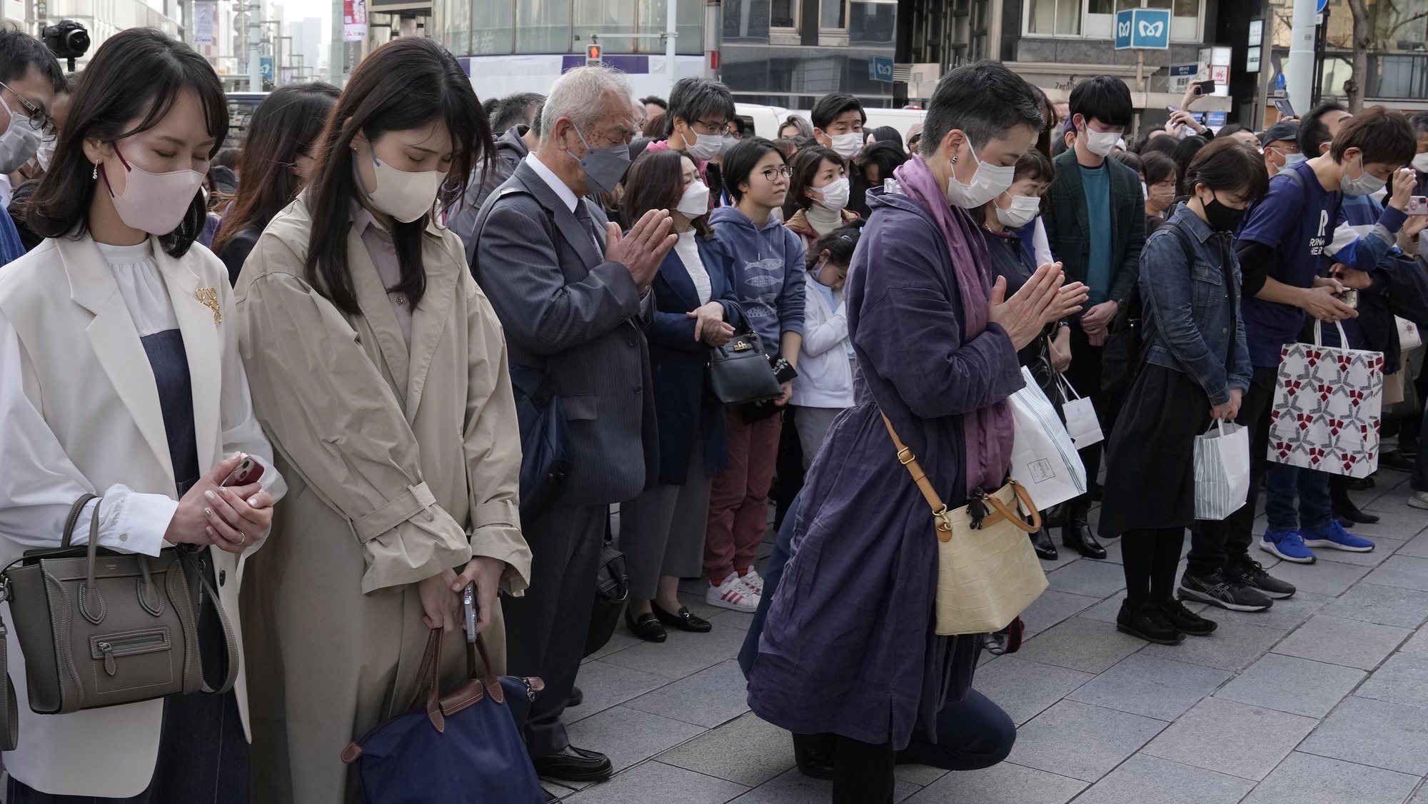 epa10514623 People offer a minute silent prayer for the victims of the &#039;Great East Japan Earthquake&#039; at the time the earthquake took place to mark its 12th anniversary, at Ginza in central Tokyo, Japan, 11 March 2023. The magnitude 9.0 earthquake triggered a tsunami that devastated the Tokyo Electric Power Company (TEPCO) Fukushima Daiichi Nuclear Power Plant, causing a nuclear accident, and the coastal side of northern Japan, killing about 16,000 people and leaving more than 2500 still missing. According to the National Police Agency, another 3,800 people died as a result of the earthquake.  EPA/KIMIMASA MAYAMA