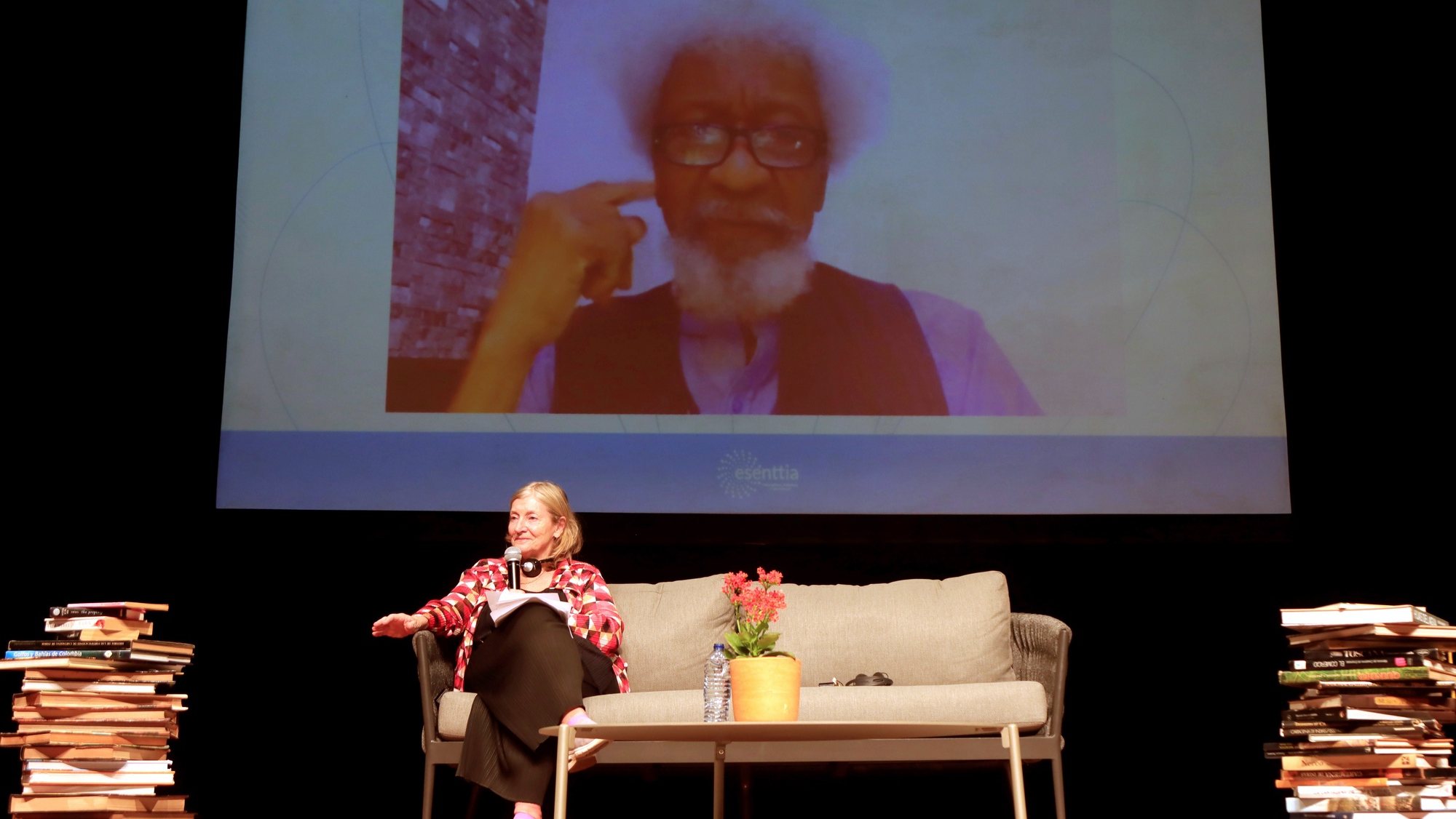 epa09718796 British journalist and writer Rosie Boycott speaks with Nigerian writer Wole Soyinka (on screen), during a conversation as part of the Hay Festival in Cartagena, Colombia, 30 January 2022. Nigerian Wole Soyinka, the first African and the first black writer to win the Nobel Prize for Literature in 1986, spoke about his activism on literature, which he said arose from when he was a child because all his life he has been &#039;quite curious&#039;. &#039;As a child I was quite curious, I was always asking and my curiosity took me to my father&#039;s library, to anything that was written, it didn&#039;t matter what it was&#039;, said the writer in a conversation with British journalist Rosie Boycott in the Hay Festival of Cartagena de Indias.  EPA/RICARDO MALDONADO ROZO