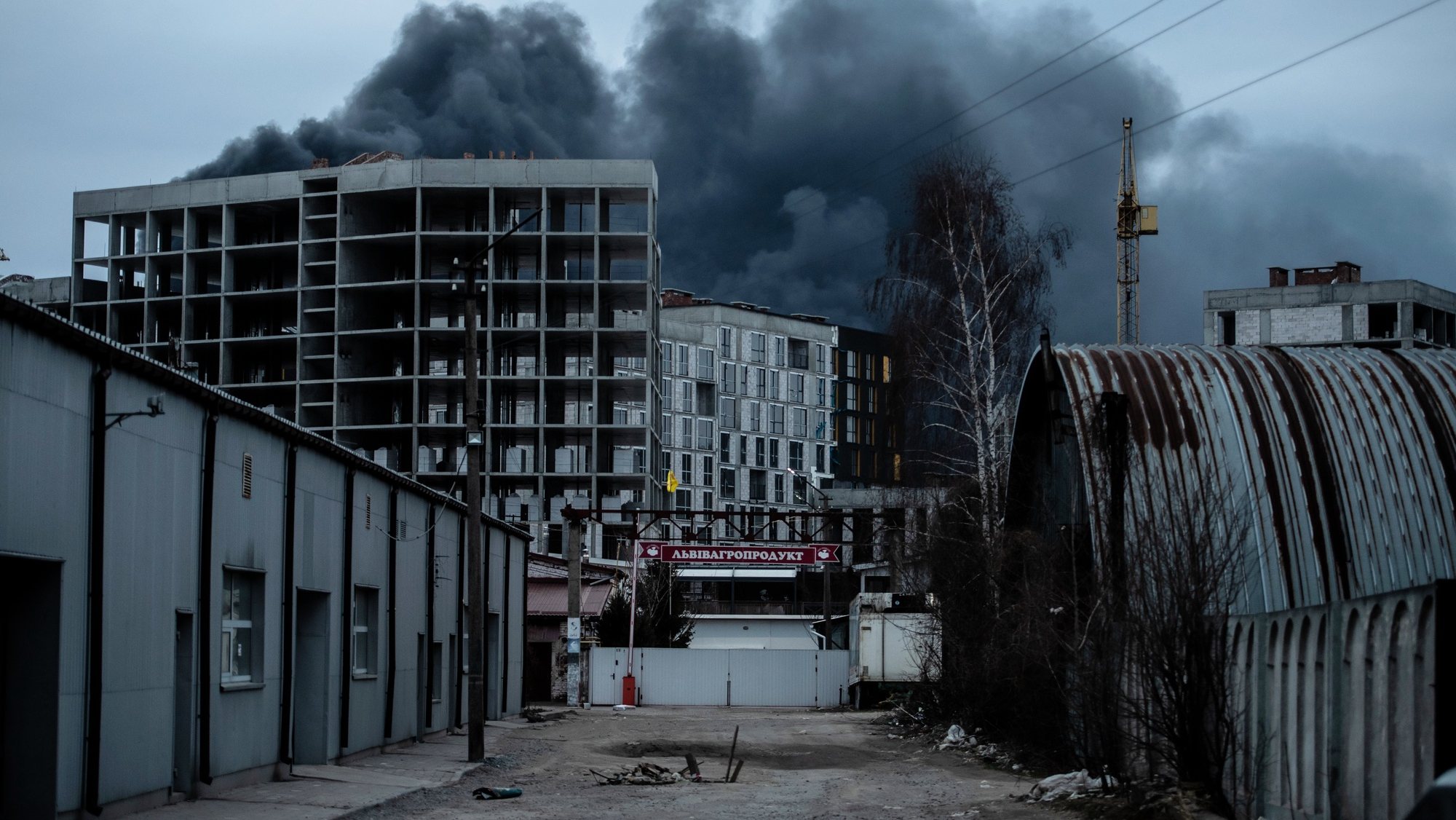 epa09851914 Smoke rises outside Lviv after a Russian airstrike, in Lviv, western Ukraine, 26 March 2022. Lviv Oblast governor Kozytskiy in a statement said three explosions were heard near Kryvchytsia and urged citizens to not reveal the locations on social media. On 24 February Russian troops had entered Ukrainian territory in what the Russian president declared a &#039;special military operation&#039;, resulting in fighting and destruction in the country, a huge flow of refugees, and multiple sanctions against Russia.  EPA/Wojtek Jargilo POLAND OUT