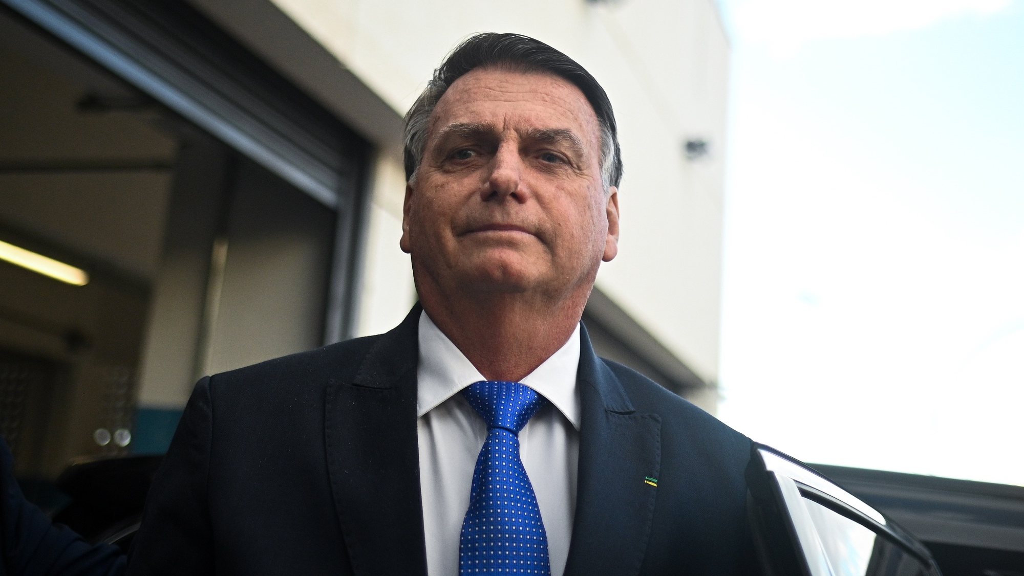 epa10742615 Former Brazilian President Jair Bolsonaro reacts after leaving the headquarter of the Federal Police in Brasilia, Brazil, 12 July 2023. Bolsonaro presented his testimony in a case of alleged coup denounced by Brazilian right-wing senator Marcos do Val.  EPA/Andre Borges