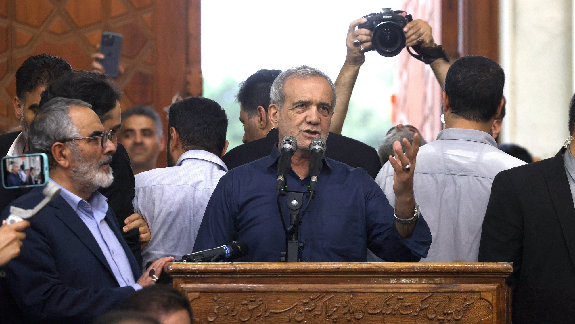 epa11463154 Iranian elected president Masoud Pezeshkian (C) speaks to the crowd after winning the presidential elections, at the Khomeini shrine in southern Tehran, Iran, 06 July 2024.  EPA/STR