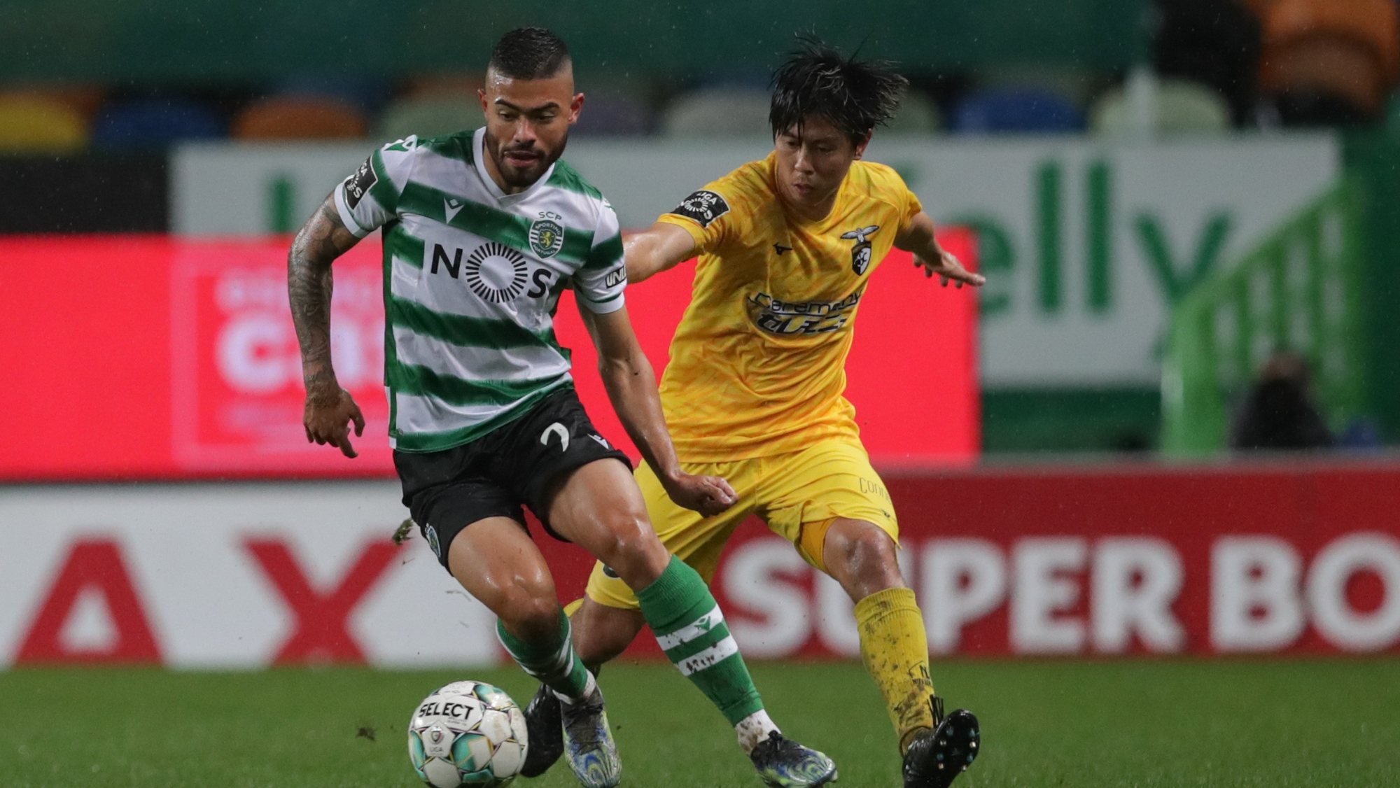 Sporting&#039;s player Bruno Tabata (L) in action against Portimonense&#039;s player Koki Anzai (R) during the Portuguese First League soccer match, Sporting vs Portimonense, held at Alvalade stadium in Lisbon, Portugal, 20 February 2021. TIAGO PETINGA/LUSA