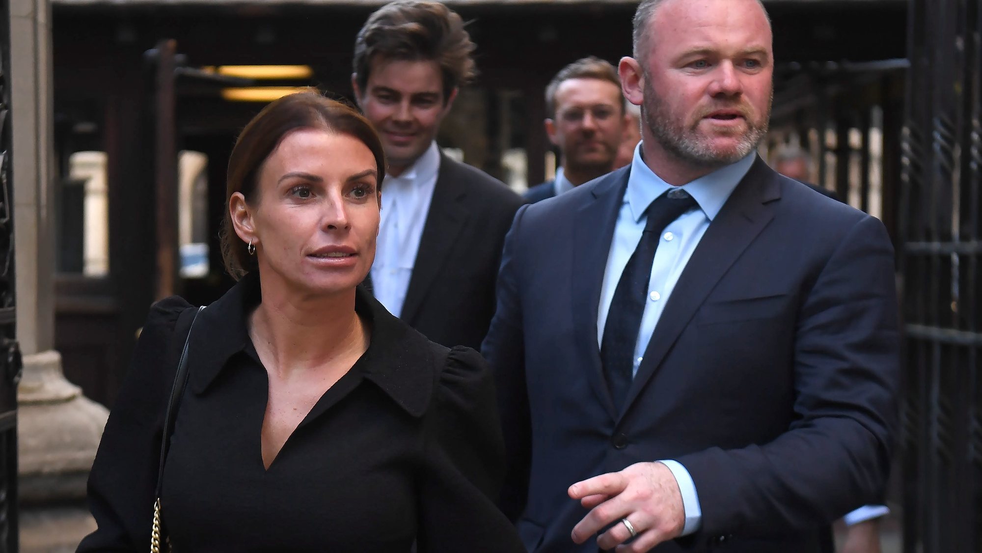 epa09953229 Coleen Rooney (L) and her soccer manager husband Wayne Rooney (R) depart the Royal Courts of Justice in London, Britain, 17 May 2022.  Footballers&#039; wives Coleen Rooney and Rebekah Vardy are facing each other in the High Court at the opening of their &#039;Wagatha Christie&#039; libel trial over a social media post. The case centres on Twitter and Instagram posts from October 2019 where Coleen Rooney alleged that someone had leaked stories to The Sun tabloid.  EPA/NEIL HALL