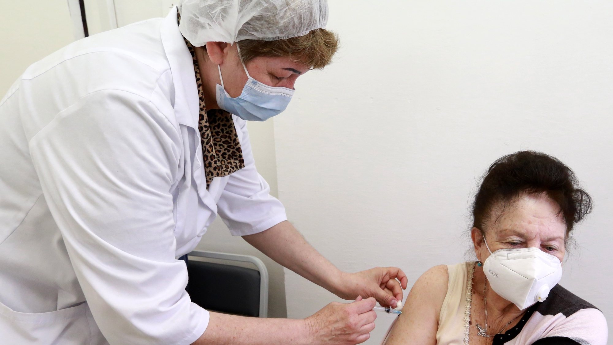 epa09163111 A Kyrgyz woman receives a jab of the Russian Sputnik V vaccine, at the Family Medicine Center No. 6, in Bishkek, Kyrgyzstan, 27 April 2021. The Kyrgyz authorities received 20,000 doses of the Sputnik V Covid-19 vaccines as assistance from Russia.  EPA/IGOR KOVALENKO