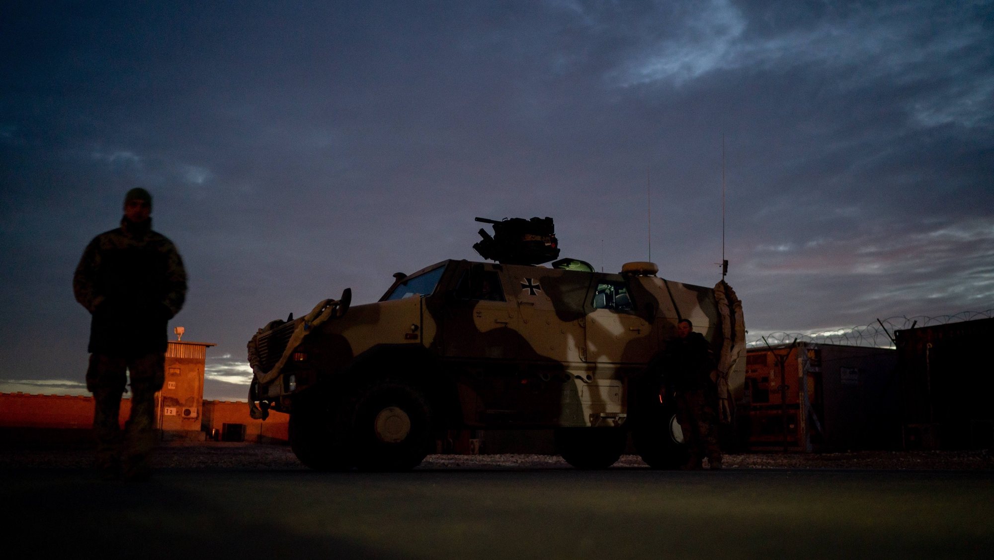 epa07238133 A German soldier stands next to a &#039;Dingo&#039; armoured vehicle as the unit waits for the arrival of Germany&#039;s Defence Minister Ursula von der Leyen (unseen) at Camp Marmal in Mazar-e Sharif, Afghanistan, 18 December 2018.German Minister Von der Leyen is paying her traditional Christmas visit to the German troops deployed in Afghanistan.  EPA/KAY NIETFELD / POOL