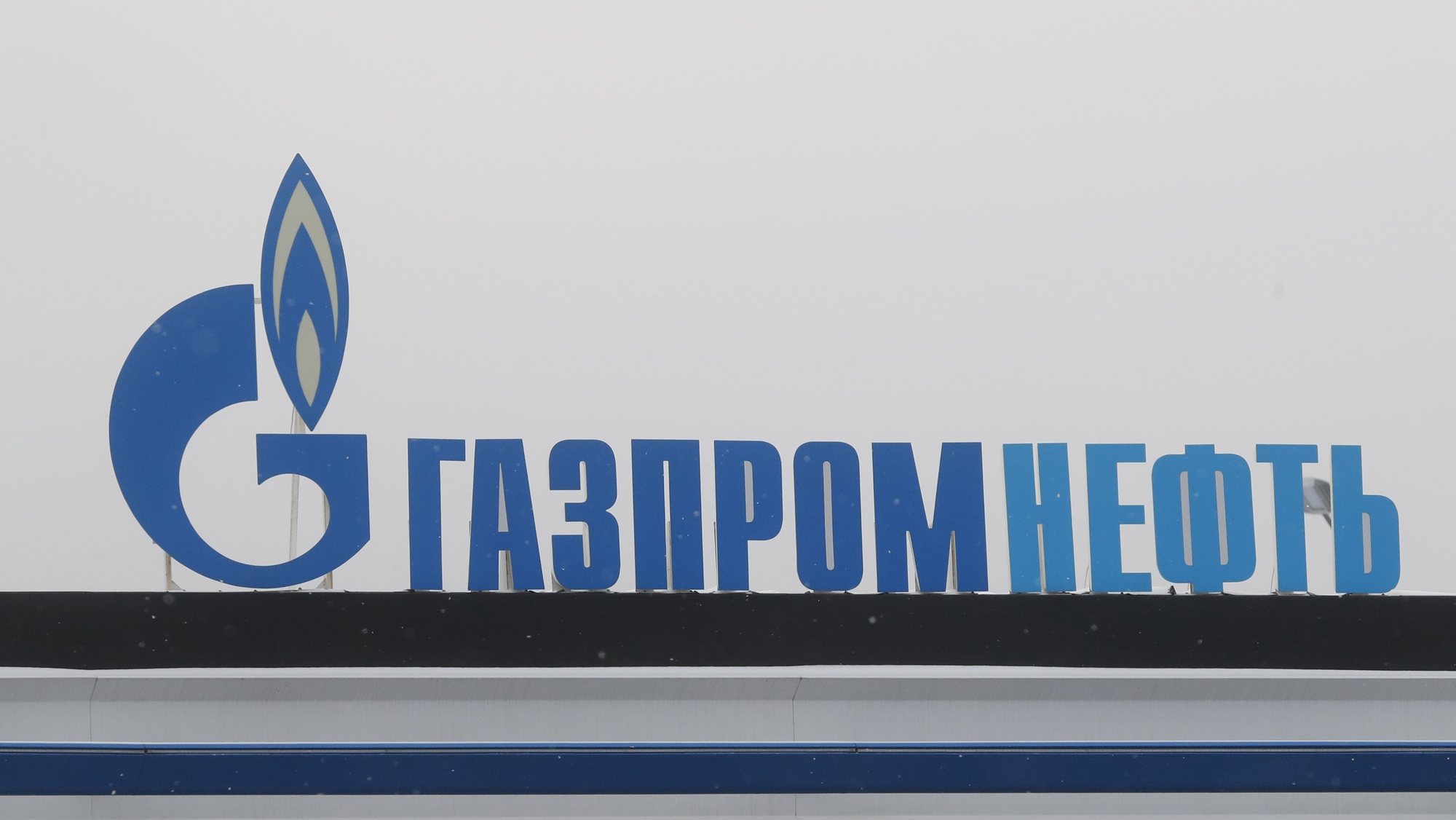 epa10479964 The logo of the Gazprom Neft Russian oil producing company at a gas station in Moscow, Russia, 20 February 2023. Gazprom Neft, one of the largest oil producing companies in Russia, is a subsidiary of Gazprom, which owns nearly 96 percent of its shares.  EPA/MAXIM SHIPENKOV