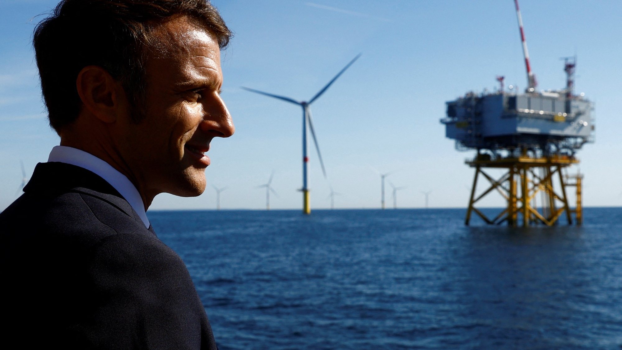 epa10198774 French President Emmanuel Macron talks with workers (not pictured) on board a boat during a visit at the Saint-Nazaire offshore wind farm, off the coast of the Guerande peninsula in western France, 22 September 2022.  EPA/STEPHANE MAHE / POOL  MAXPPP OUT