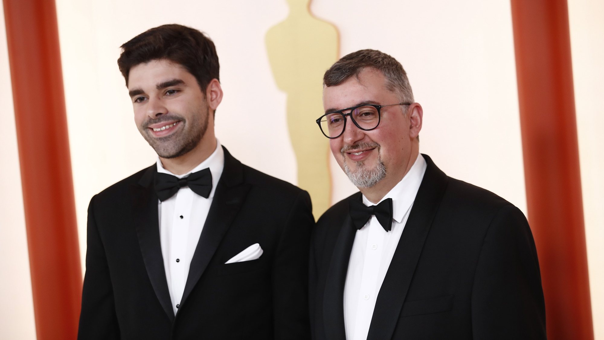 epa10517751 (L-R) Joao Gonzalez and Bruno Caetano arrive for the 95th annual Academy Awards ceremony at the Dolby Theatre in Hollywood, Los Angeles, California, USA, 12 March 2023. The Oscars are presented for outstanding individual or collective efforts in filmmaking in 24 categories.  EPA/CAROLINE BREHMAN