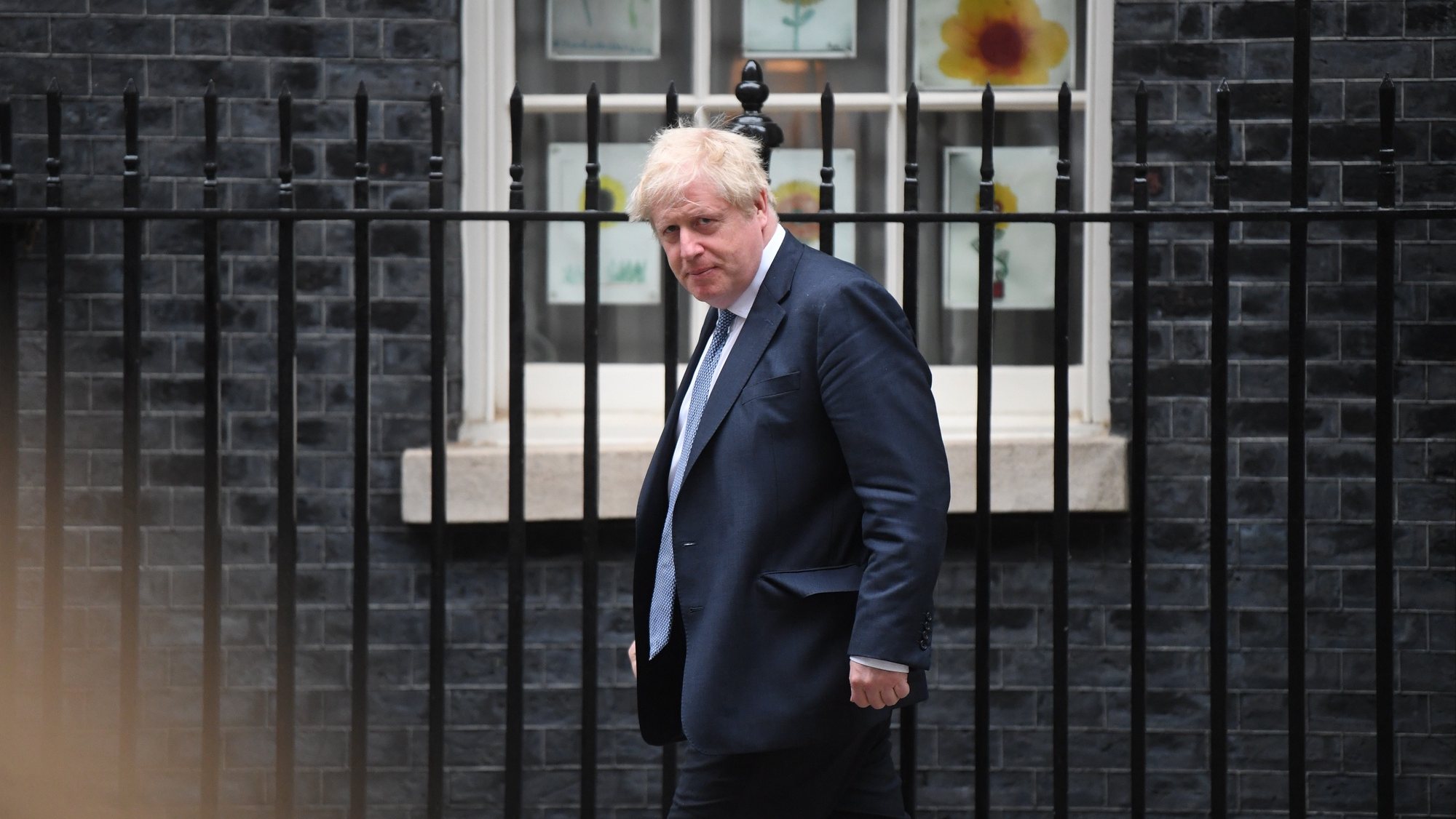 epa09937631 British Prime Minister Boris Johnson leaves Number 10 Downing Street in advance of the State Opening of Parliament in London, Britain, 10 May 2022. The British government is expected to promise to get the country &#039;back on track&#039; as it unveils its plans for the year ahead in the Queen&#039;s Speech.  EPA/NEIL HALL