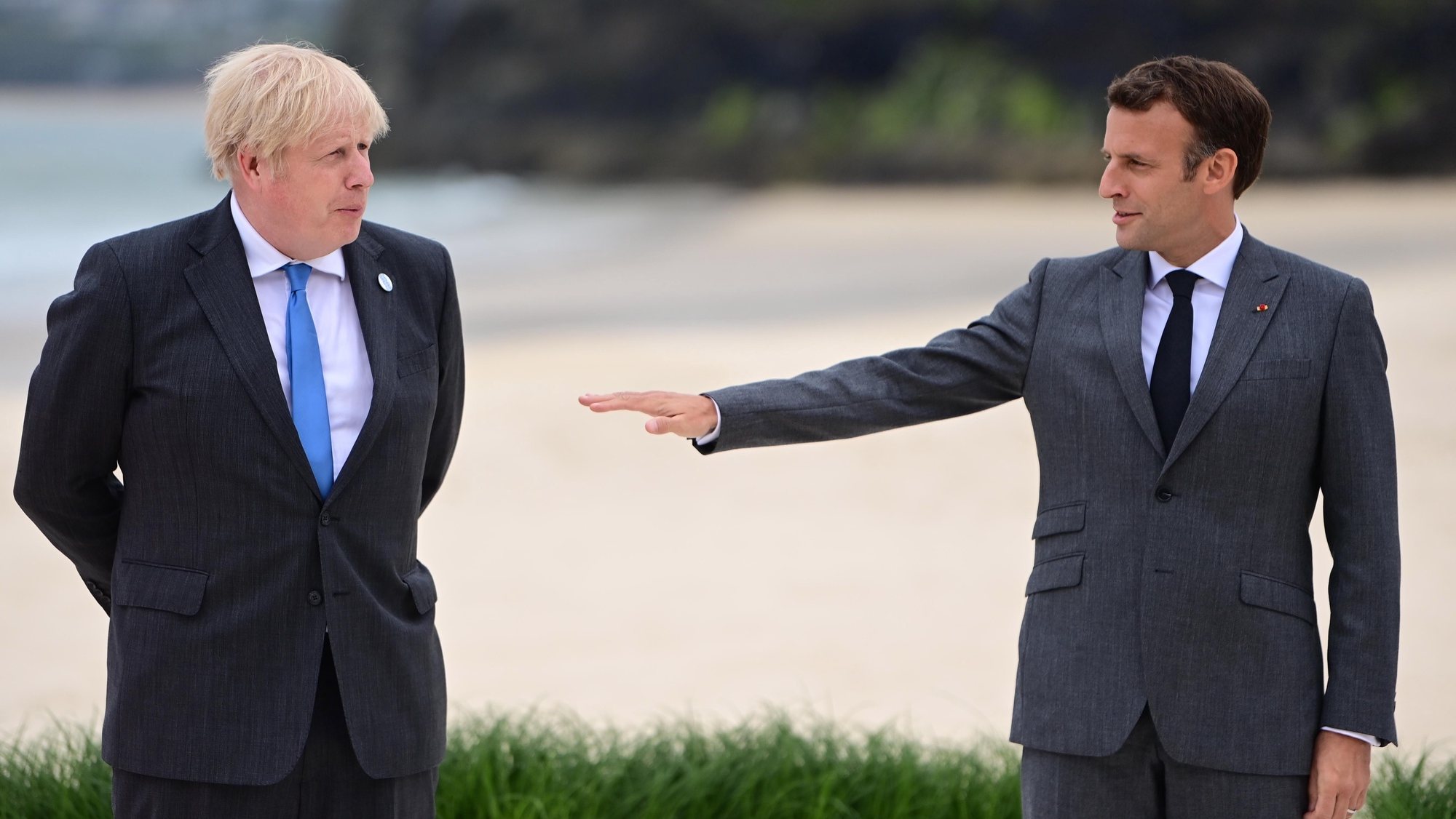 epa09262505 France&#039;s President Emmanuel Macron (R) greets Britain&#039;s Prime Minister Boris Johnson (L) at the official leaders welcome during the G7 Summit in Carbis Bay, Britain, 11 June 2021. Britain hosts the Group of Seven (G7) summit in Cornwall from 11 to 13 June 2021.  EPA/NEIL HALL/POOL