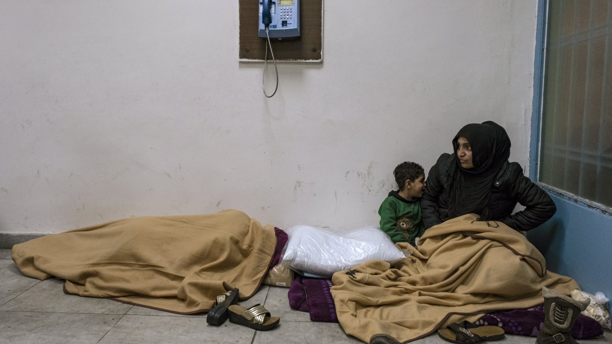epa10452223 People take shelter in a state building following an earthquake in Diyarbakir, Turkey, 06 February 2023 (issued 07 February 2023). More than 4,000 people were killed and thousands more injured after a major 7.8 magnitude earthquake struck southern Turkey and northern Syria on 06 February. Authorities fear the death toll will keep climbing as rescuers look for survivors across the region.  EPA/REFIK TEKIN