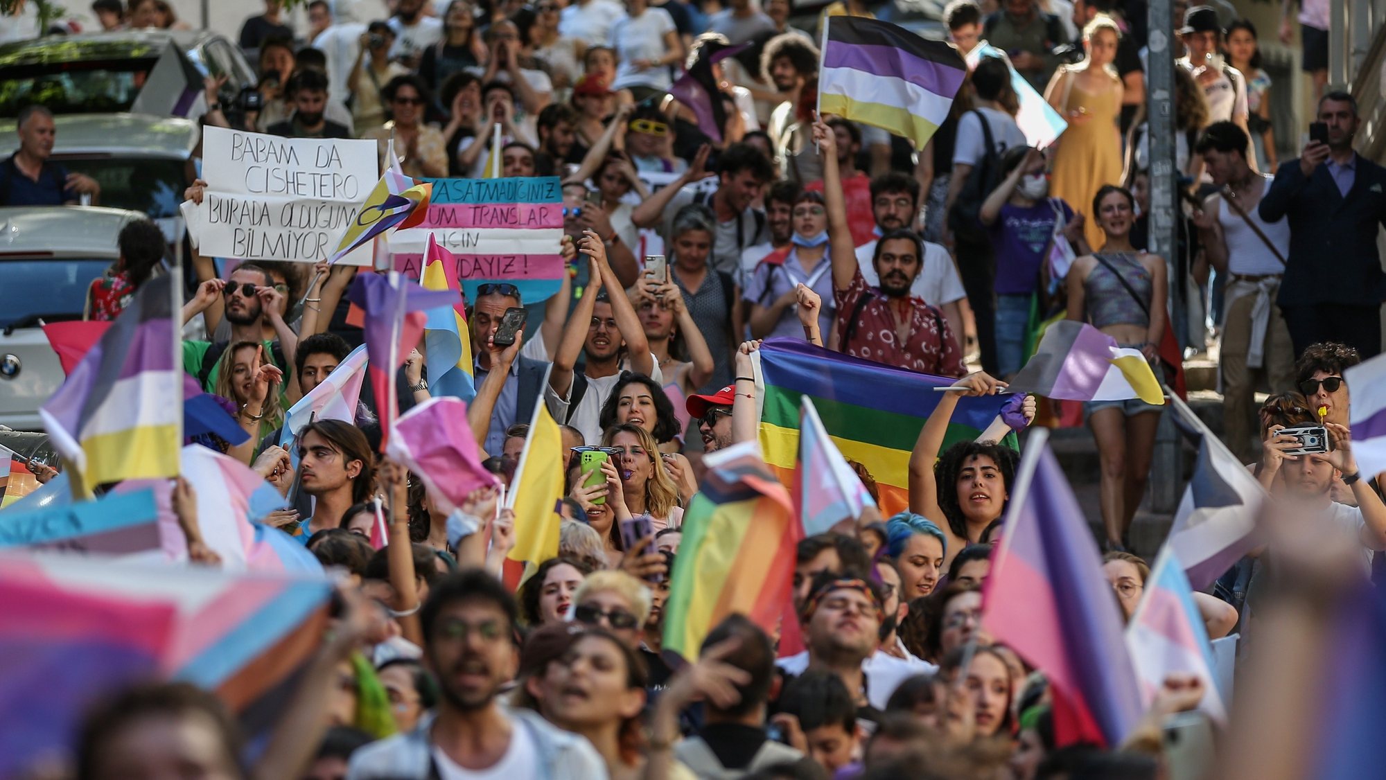epa10035289 LGBT (lesbian, gay, bisexual, transgender) community members and supporters hold rainbow-colored flags and banners and shout slogans during the ​Istanbul Pride March, in Istanbul, Turkey, 26 June 2022. The Turkish Goverment has banned the Istanbul Pride March as they already did in previous years.  EPA/ERDEM SAHIN