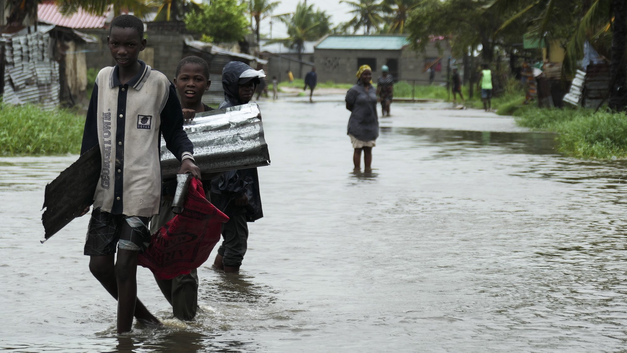 Kids passes on a flooded street near Quelimane, as the storm Freddy hits Mozambique, 11 March 2023. The provincial capital of Quelimane will be the largest urban area closest to the cyclone&#039;s point of arrival on the mainland, and its radius (of about 300 kilometres) is expected to extend from Marromeu to Pebane, then moving inland towards Cherimane and southern Malawi. This is one of the longest lasting storms ever, after it formed at the beginning of February in the Asian seas, crossing the entire Indian Ocean to the east African coast. ANDRE CATUEIRA/LUSA